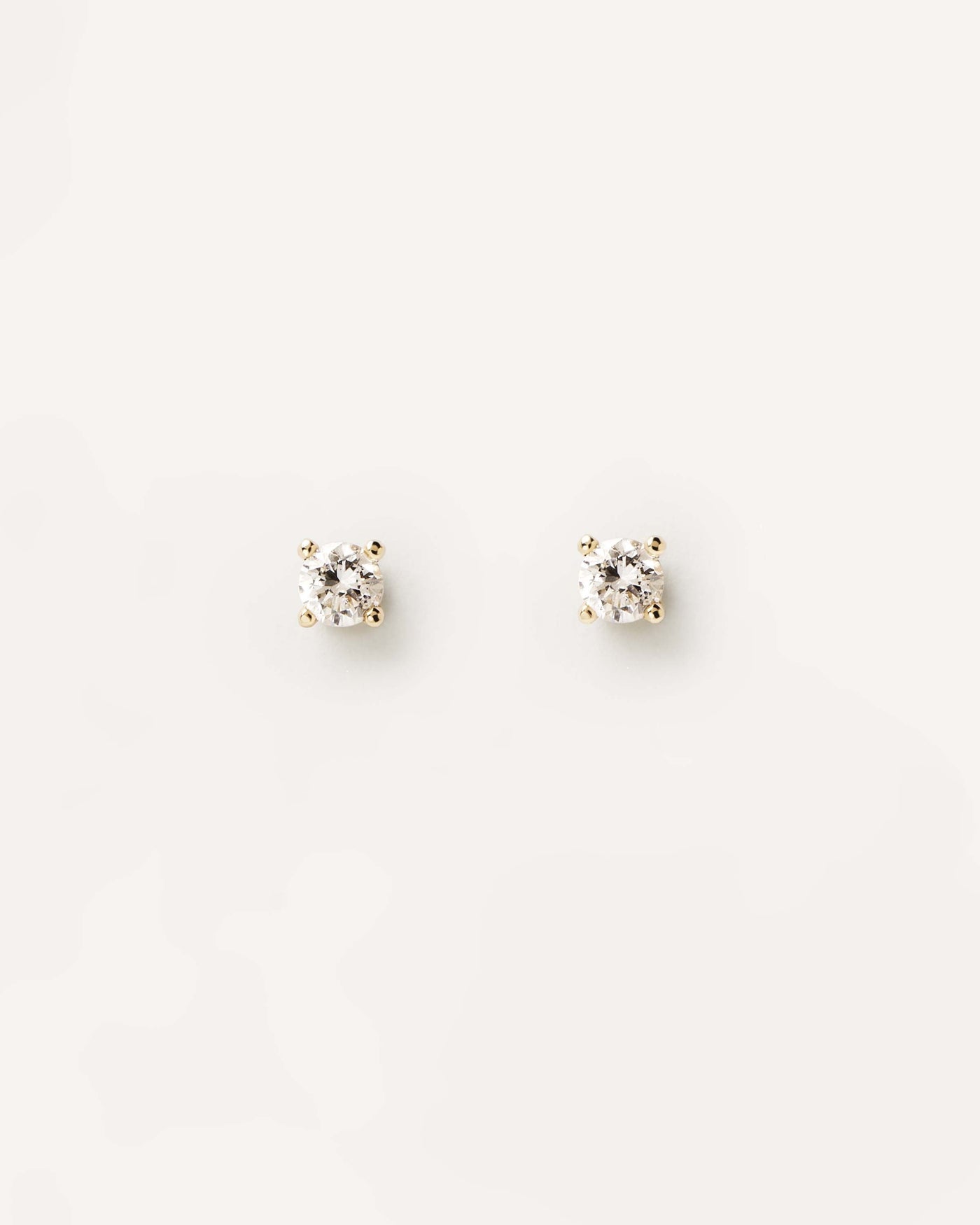 2023 Selection | Diamonds and Gold Solitaire Studs. 18K yellow gold pin earrings with lab-grown solitary diamond of 0.10 carat each. Get the latest arrival from PDPAOLA. Place your order safely and get this Best Seller. Free Shipping.