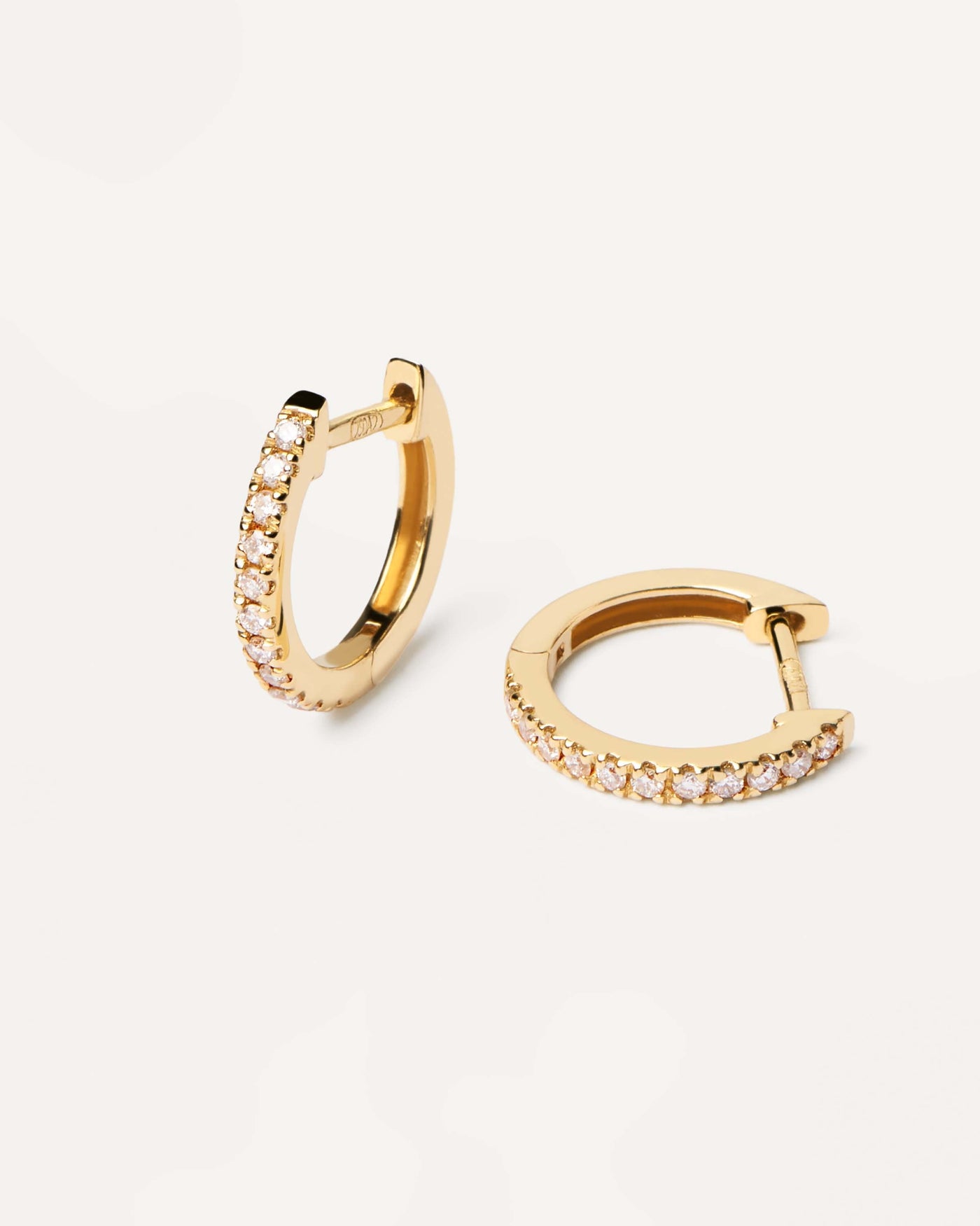 2024 Selection | Diamonds and Gold Eternity Mini Hoops. Small 18K yellow gold hoop earrings, set with lab-grown diamonds of 0.18 carats in total. Get the latest arrival from PDPAOLA. Place your order safely and get this Best Seller. Free Shipping.