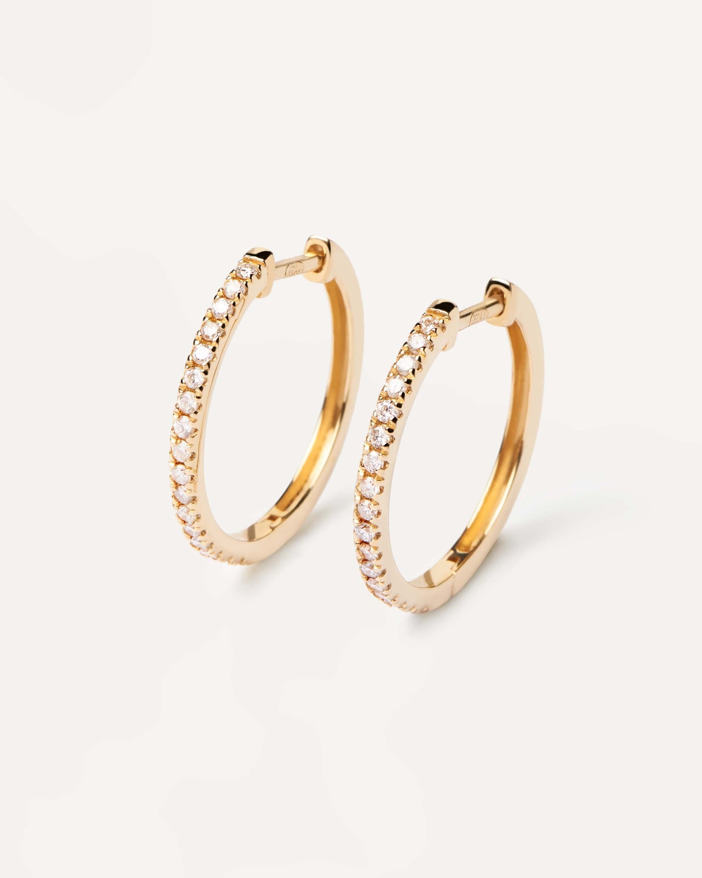 2024 Selection | Diamonds and Gold Eternity Medium Hoops. Solid yellow gold hoop earrings, set with lab-grown diamonds of 0.39 carats in total. Get the latest arrival from PDPAOLA. Place your order safely and get this Best Seller. Free Shipping.