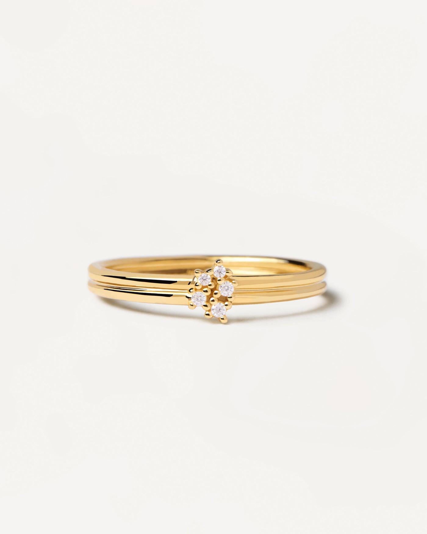 2023 Selection | Nova Ring. Gold-plated silver ring with two bands set with five dainty zirconias. Get the latest arrival from PDPAOLA. Place your order safely and get this Best Seller. Free Shipping.
