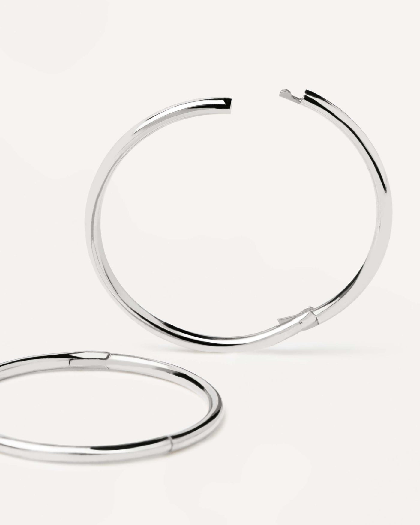 2024 Selection | White Gold Essential Medium Hoops. Perfect circle hoops with plain design, made of recycled white gold. Get the latest arrival from PDPAOLA. Place your order safely and get this Best Seller. Free Shipping.