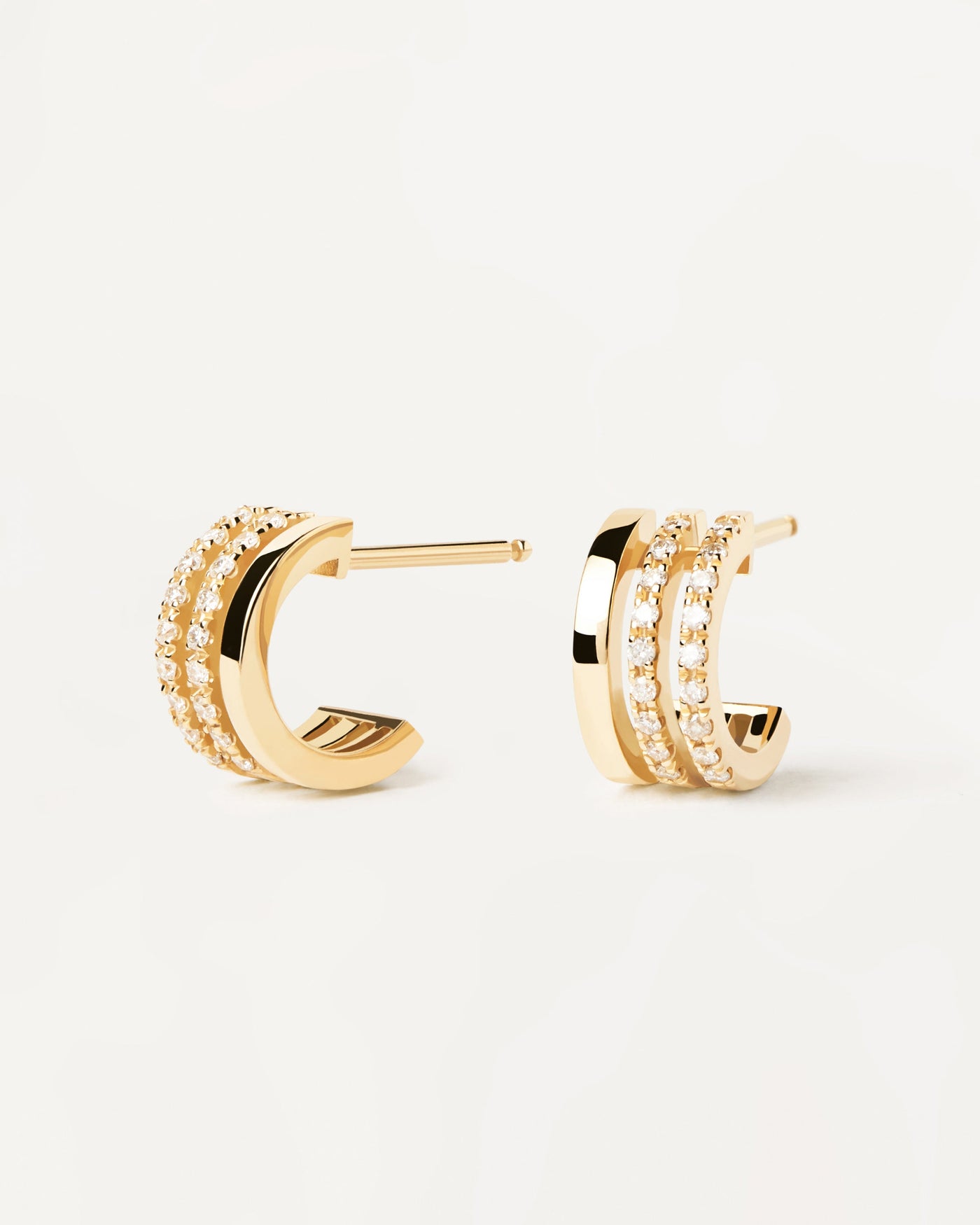 2023 Selection | Diamonds And Gold Triple Hoops. 18K yellow gold earrings with 3 half hoops: one plain & two with diamonds of 0.18 carat. Get the latest arrival from PDPAOLA. Place your order safely and get this Best Seller. Free Shipping.