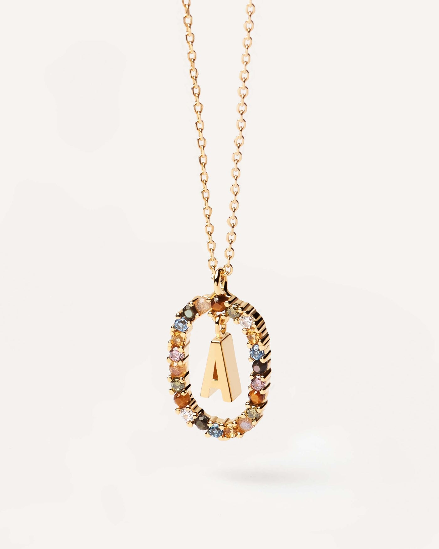2023 Selection | Letter A necklace. Initial A necklace in gold-plated silver, circled by colorful gemstones. Get the latest arrival from PDPAOLA. Place your order safely and get this Best Seller. Free Shipping.