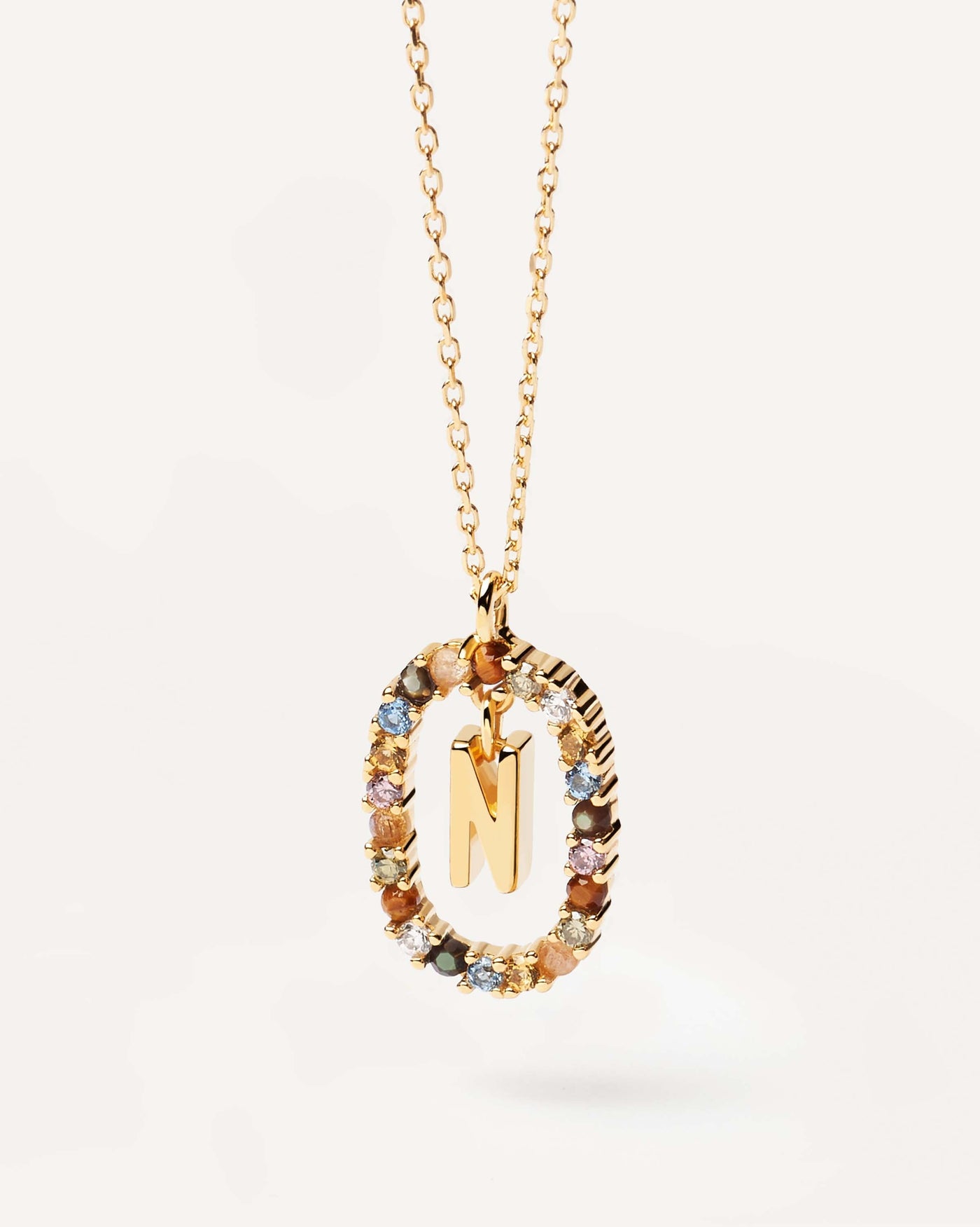 2023 Selection | Letter N necklace. Initial N necklace in gold-plated silver, circled by colorful gemstones. Get the latest arrival from PDPAOLA. Place your order safely and get this Best Seller. Free Shipping.