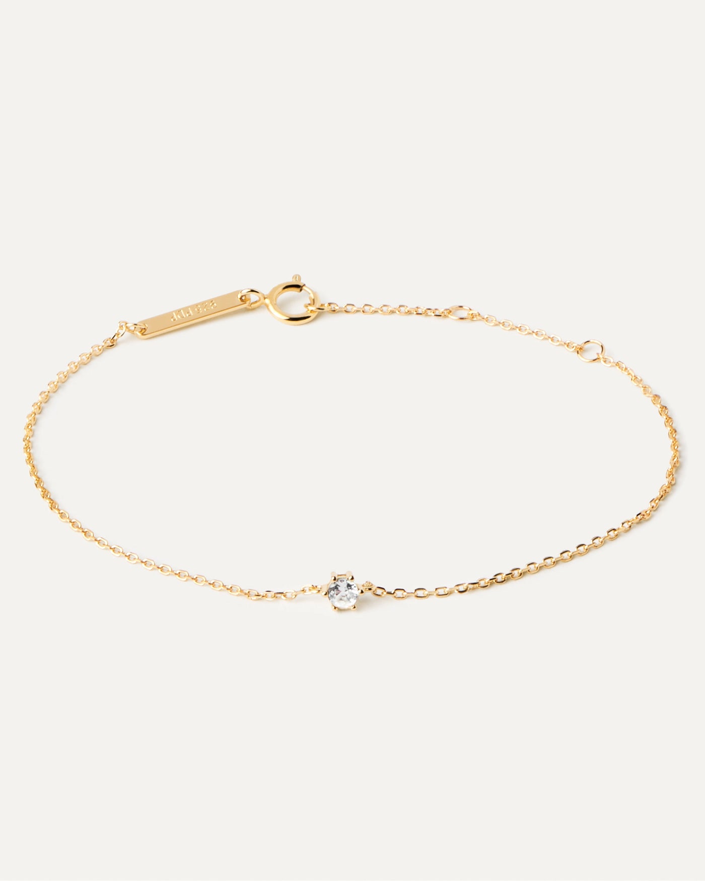 2023 Selection | White Solitary Bracelet. Thin chain bracelet in 18k gold plated silver and a white zirconia. Get the latest arrival from PDPAOLA. Place your order safely and get this Best Seller. Free Shipping.