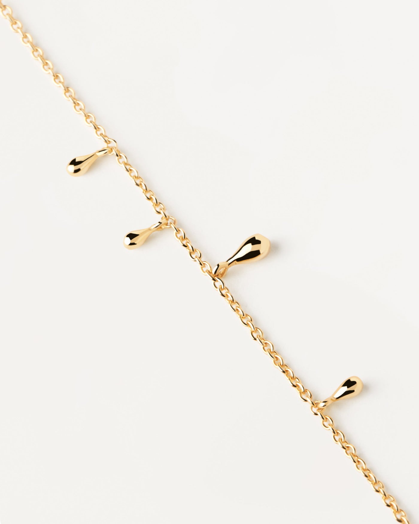 2023 Selection | Teardrop Bracelet. Gold-plated silver bracelet with small drop pendants. Get the latest arrival from PDPAOLA. Place your order safely and get this Best Seller. Free Shipping.