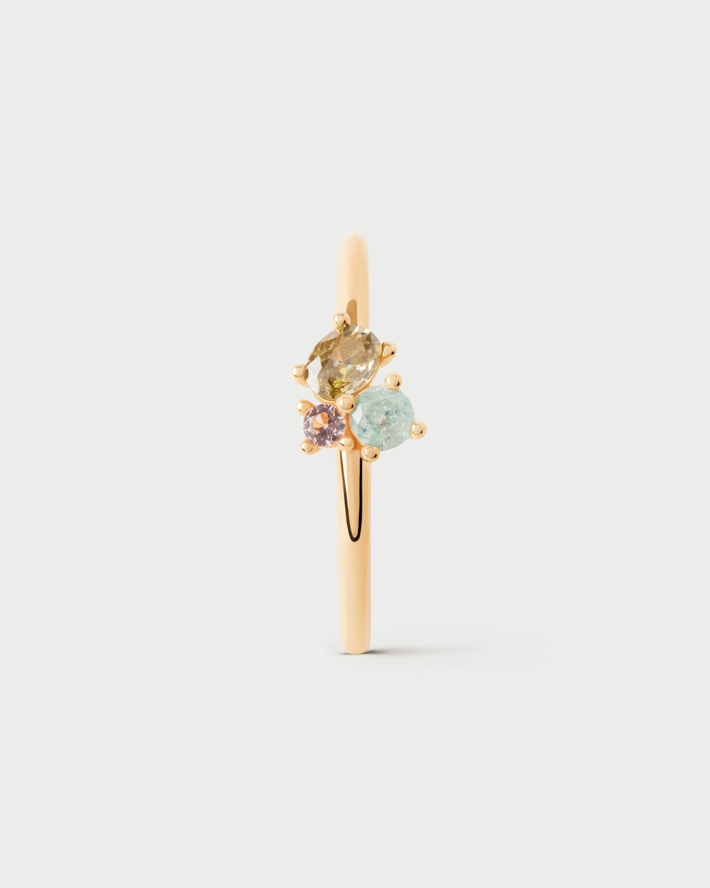 Dainty ring adorned with three colorful zirconia that graduate in size and shape