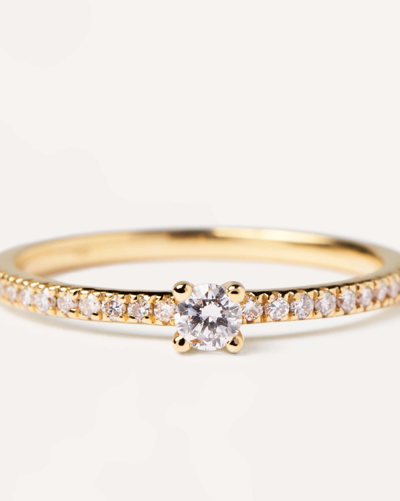 2023 Selection | Diamonds and gold Solstice Ring. Solid yellow gold ring with diamond eternity band and a round cut center diamond, making 0.31K. Get the latest arrival from PDPAOLA. Place your order safely and get this Best Seller. Free Shipping.