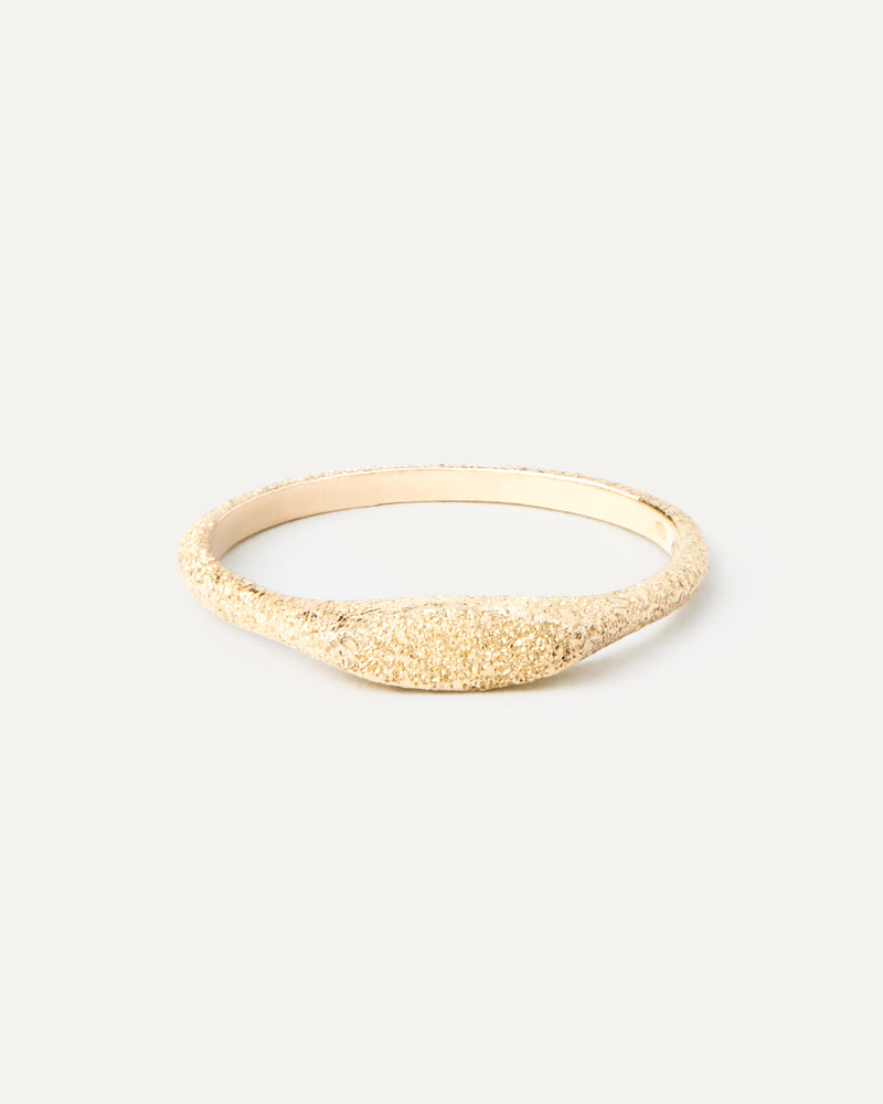 Slim signet ring in solid 18K yellow gold with a sandblast finish