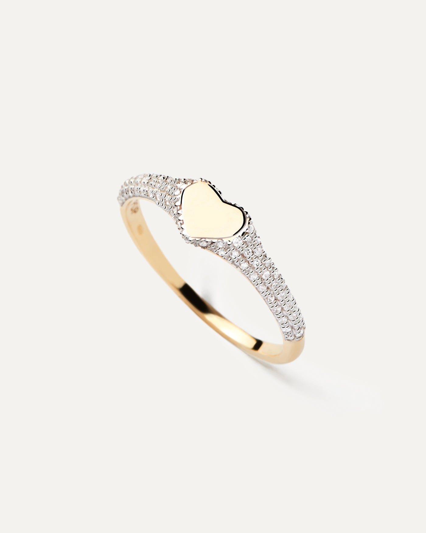 2023 Selection | Diamonds and Gold Heart Stamp Ring. Heart-shaped signet ring in solid yellow gold set with 76 pavé diamonds of 0.23 carats. Get the latest arrival from PDPAOLA. Place your order safely and get this Best Seller. Free Shipping.