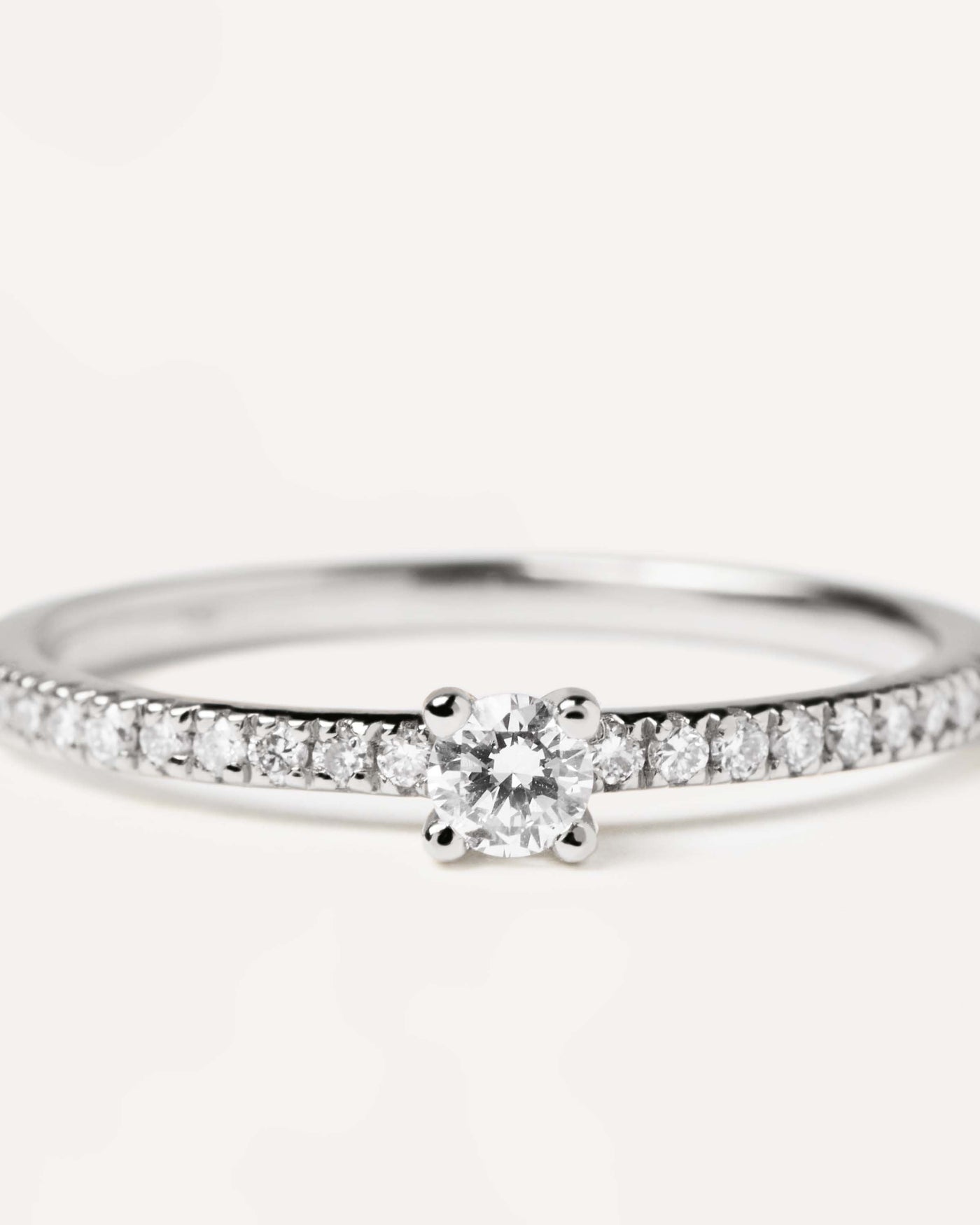 2023 Selection | Diamonds and White Gold Solstice Ring. Solid white gold ring with diamond eternity band and a round cut center diamond, making 0.31K. Get the latest arrival from PDPAOLA. Place your order safely and get this Best Seller. Free Shipping.