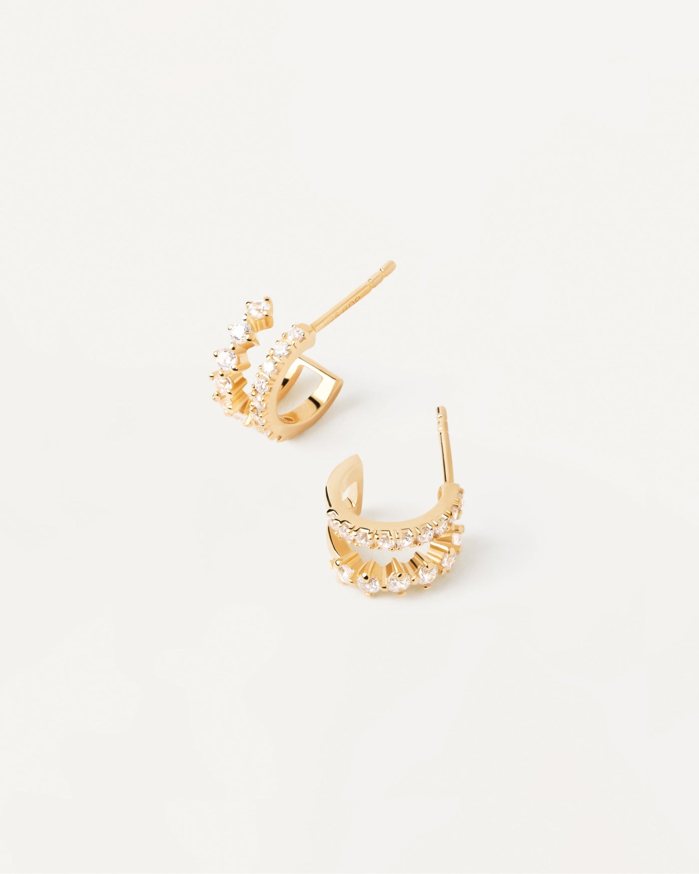 2023 Selection | Rubi Earrings. Double eternity hoops in gold-plated silver with white zirconia. Get the latest arrival from PDPAOLA. Place your order safely and get this Best Seller. Free Shipping.