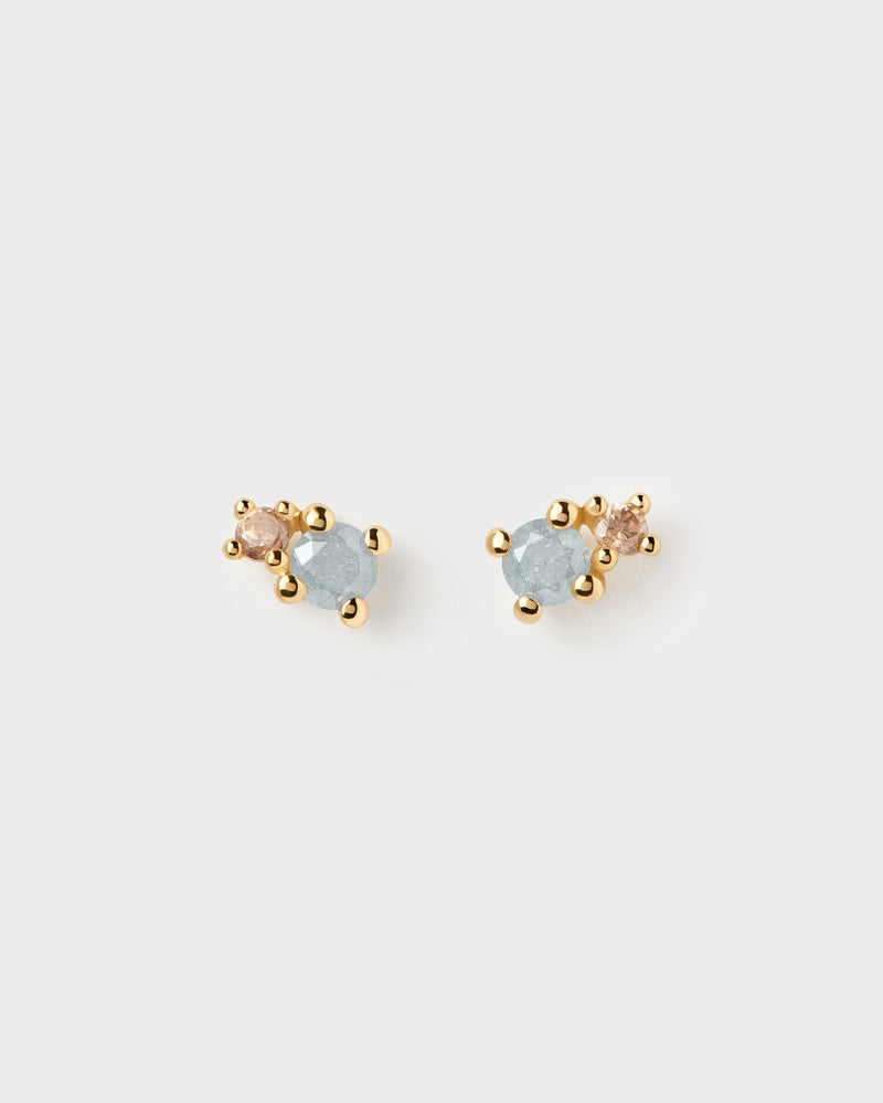Pendientes asimétricos redondos adornados con circonitas gris hielo y marrón