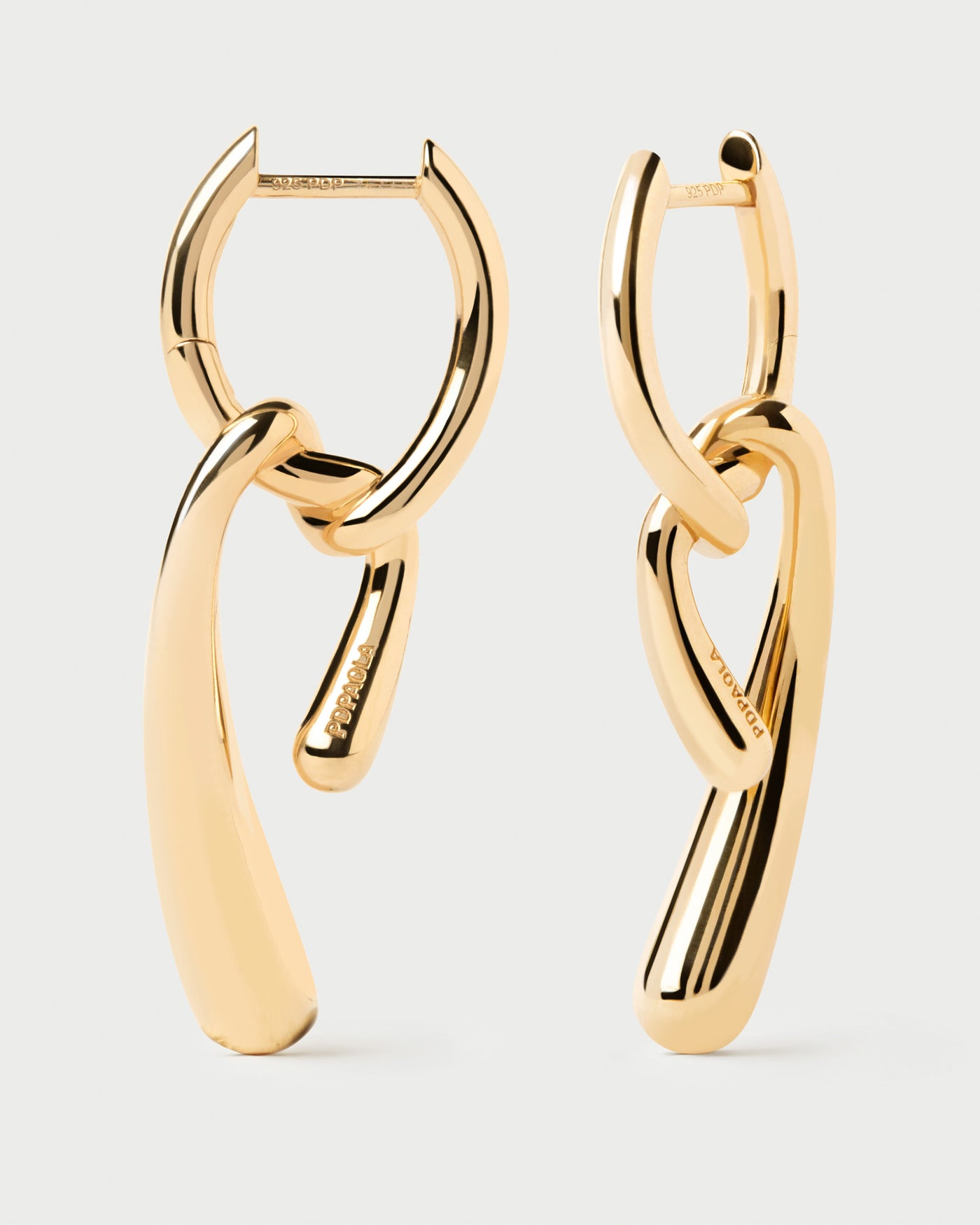 Asymmetric hoop earrings with fluid knotted pendants
