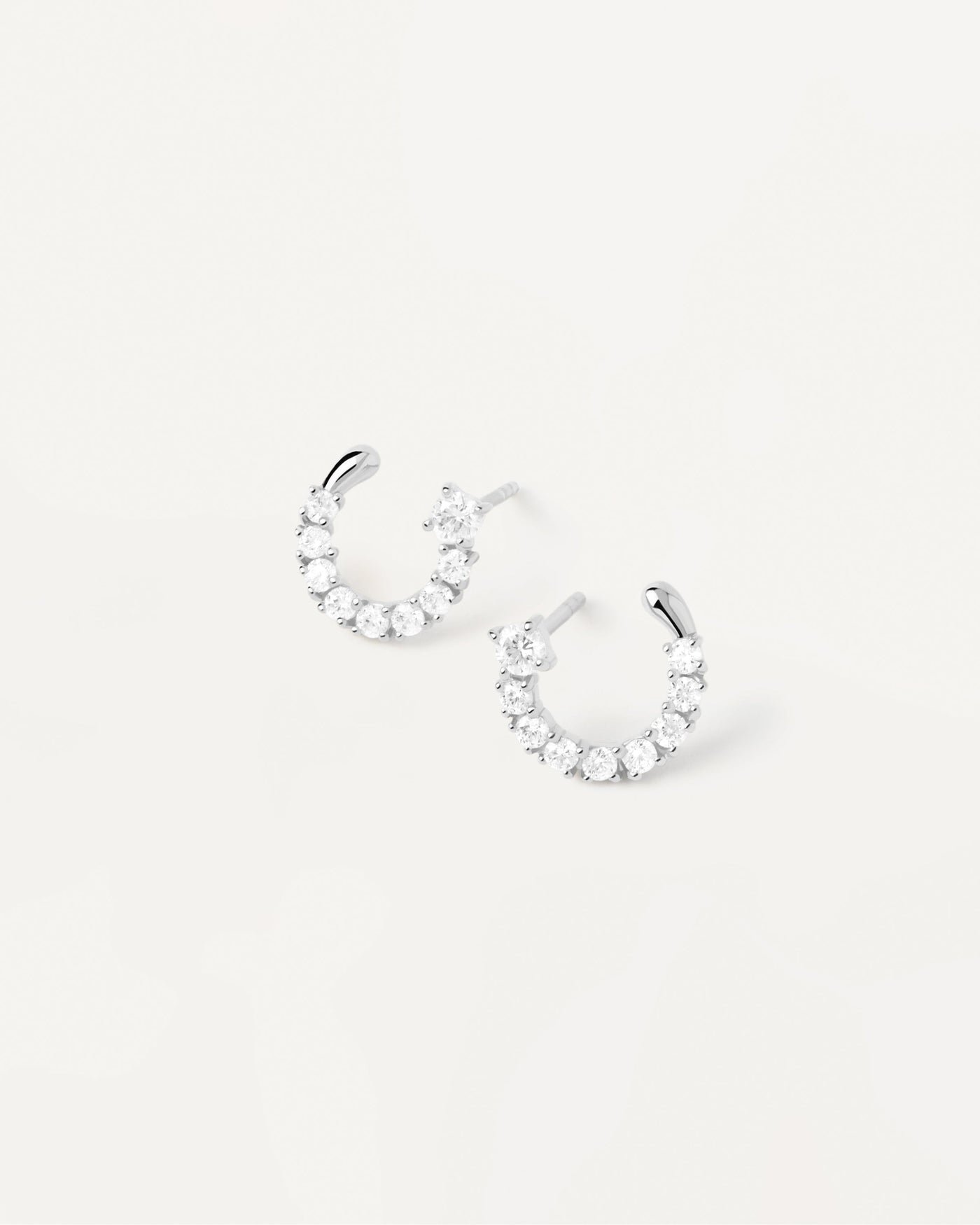 2023 Selection | Leona Silver Earrings. Semi-circle small earrings in sterling silver with white crystals. Get the latest arrival from PDPAOLA. Place your order safely and get this Best Seller. Free Shipping.