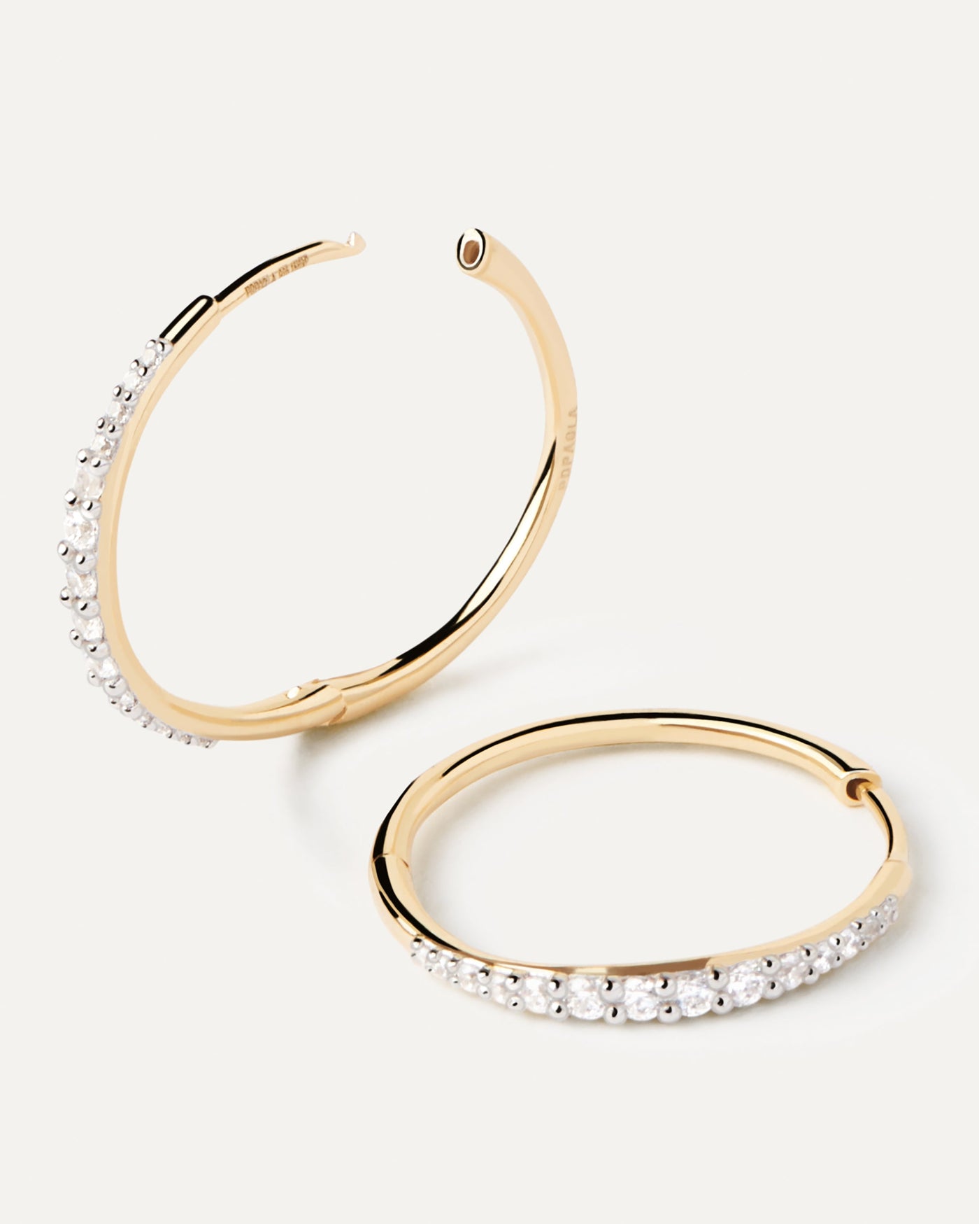 2023 Selection | Diamonds And Gold Estella Hoops. Slim hoop earrings in yellow gold with pavé diamonds of 0.37 carats. Get the latest arrival from PDPAOLA. Place your order safely and get this Best Seller. Free Shipping.