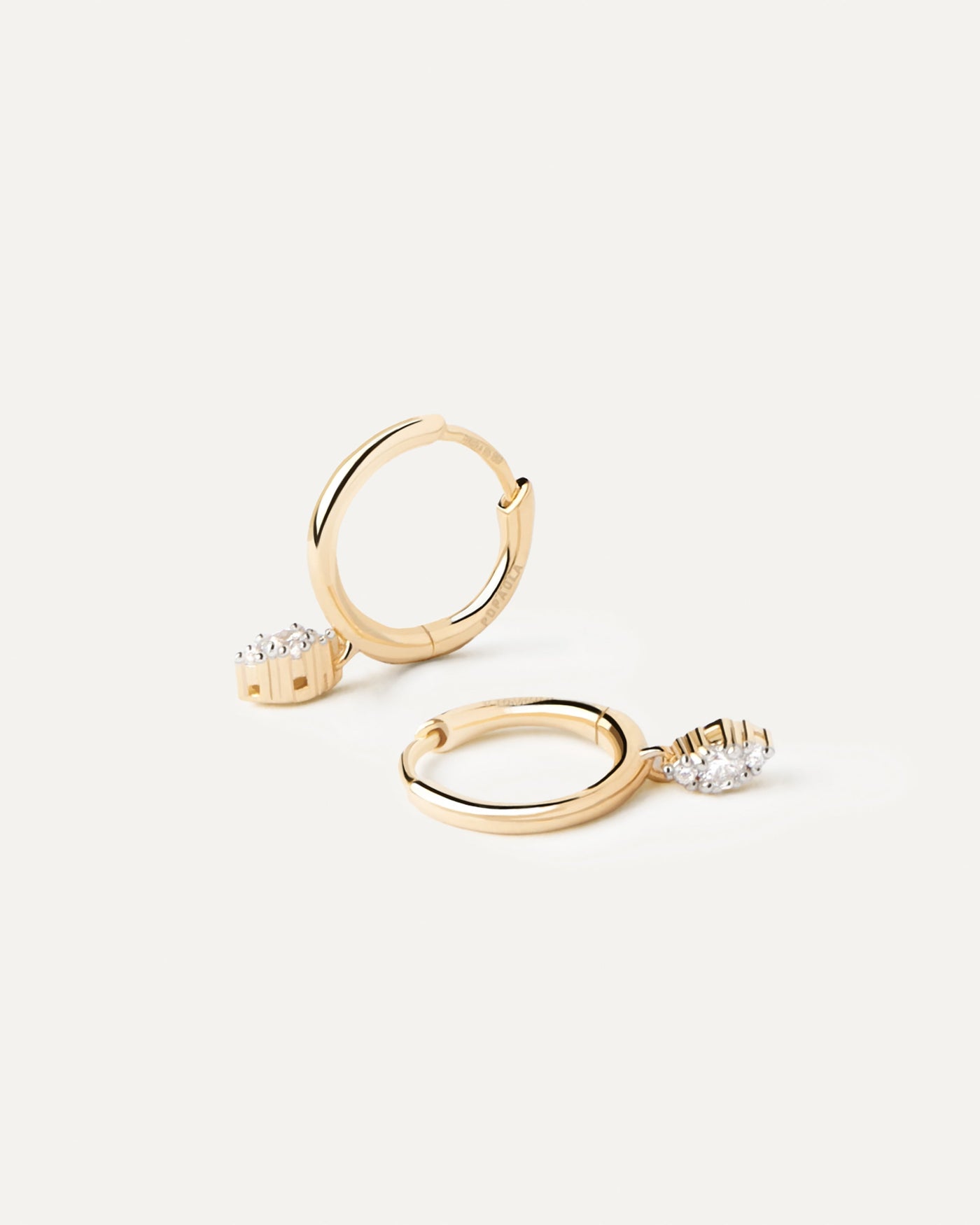 2023 Selection | Diamonds And Gold Emi Hoops. Yellow gold hoops with small diamonds pendant of 0.08 carats each earring. Get the latest arrival from PDPAOLA. Place your order safely and get this Best Seller. Free Shipping.