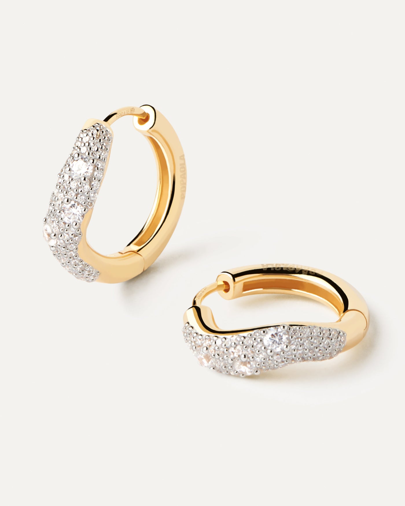 2023 Selection | Diamonds And Gold Apollo Hoops. Wavy hoop earrings in yellow gold with pavé diamonds of 0.9 carats. Get the latest arrival from PDPAOLA. Place your order safely and get this Best Seller. Free Shipping.