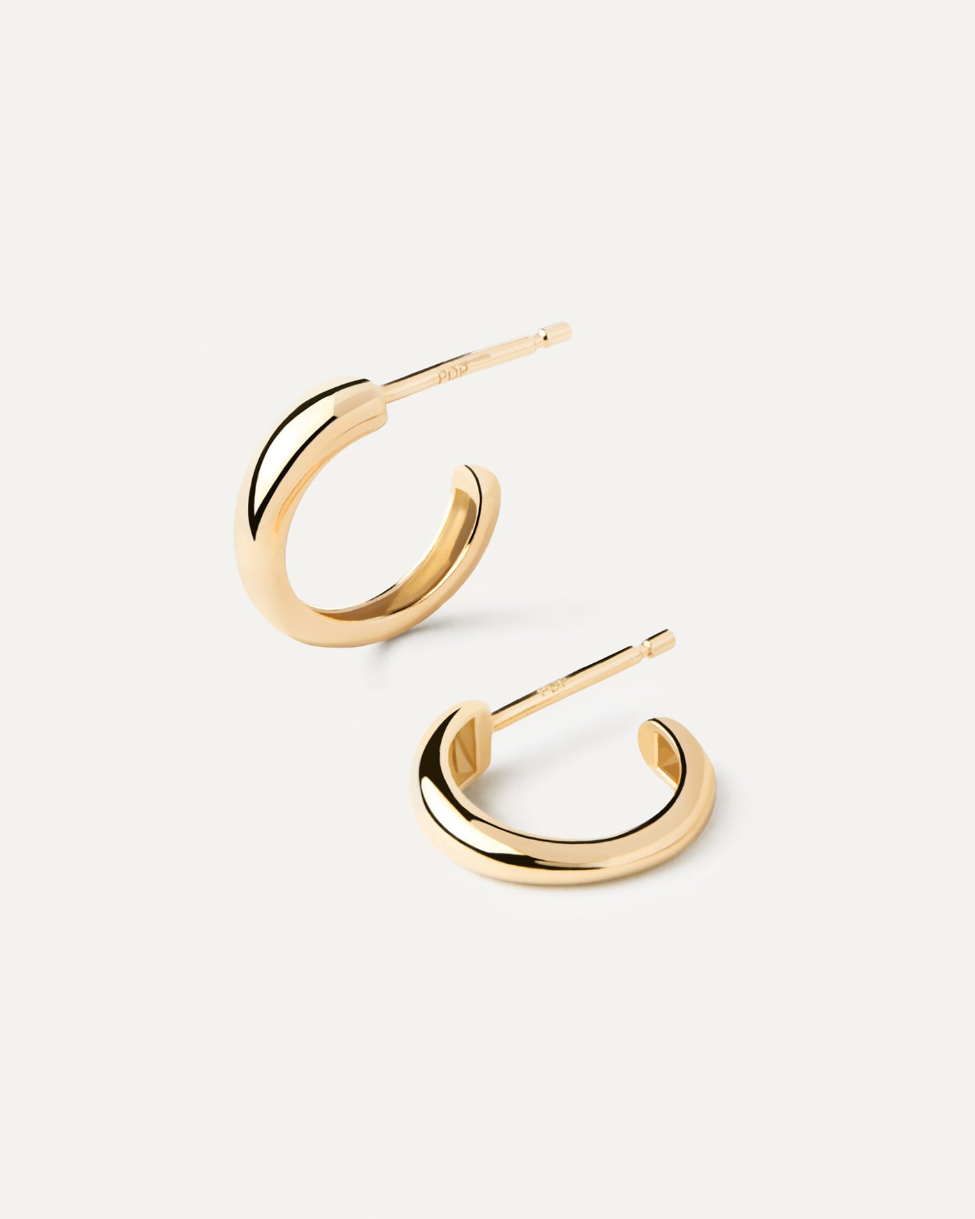2023 Selection | Gold Joan Mini Hoops. Small hoop earrings in solid 18K yellow gold with rounded edges. Get the latest arrival from PDPAOLA. Place your order safely and get this Best Seller. Free Shipping.