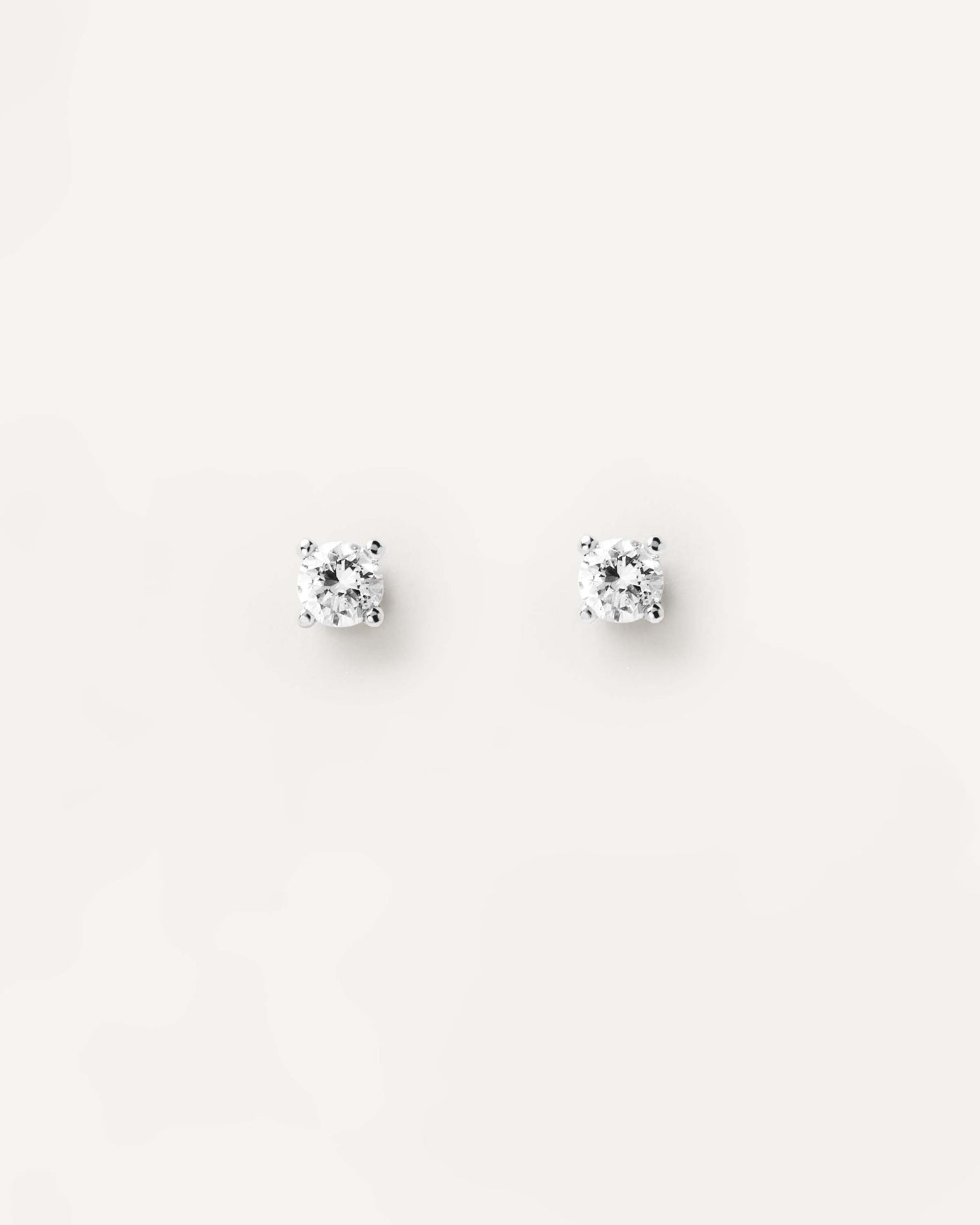 2023 Selection | Diamonds and White Gold Solitaire Studs. 18K white gold pin earrings with lab-grown solitary diamond of 0.10 carat each. Get the latest arrival from PDPAOLA. Place your order safely and get this Best Seller. Free Shipping.