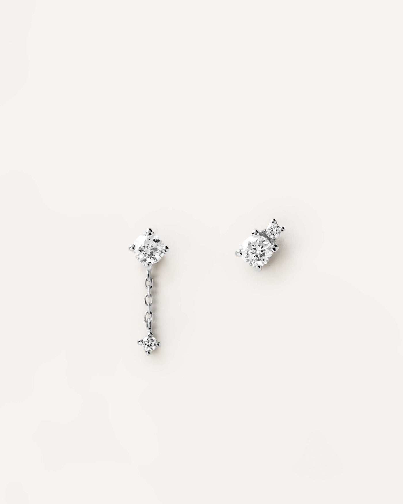 2023 Selection | Diamonds and White Gold Asymetric Studs. Asymmetric earrings in solid white gold with 0.23 carats diamonds. Get the latest arrival from PDPAOLA. Place your order safely and get this Best Seller. Free Shipping.