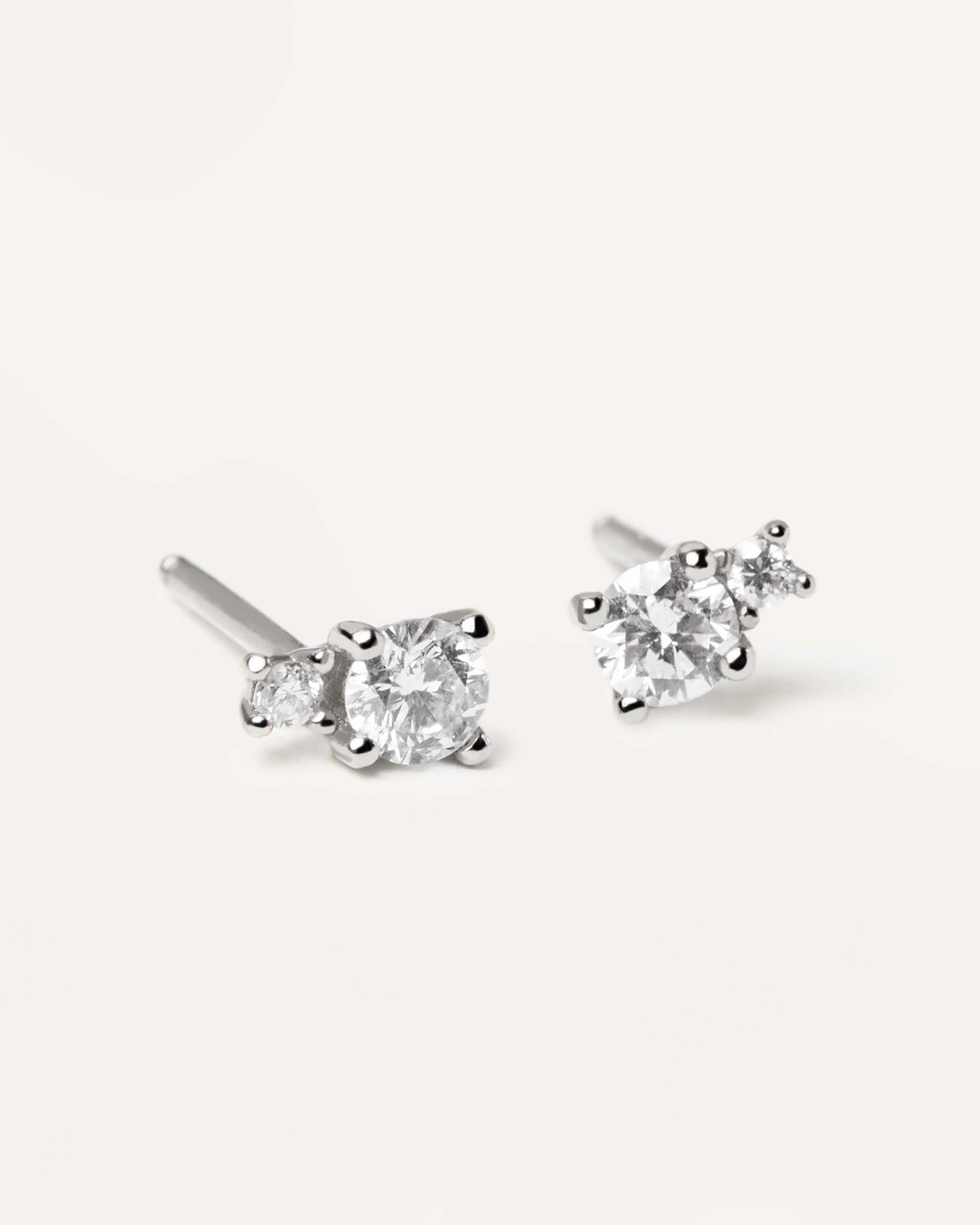 2024 Selection | Diamonds and White Gold Solitaire Duo Studs. Solid white gold studs with two different sizes diamonds of 0.23 carats. Get the latest arrival from PDPAOLA. Place your order safely and get this Best Seller. Free Shipping.