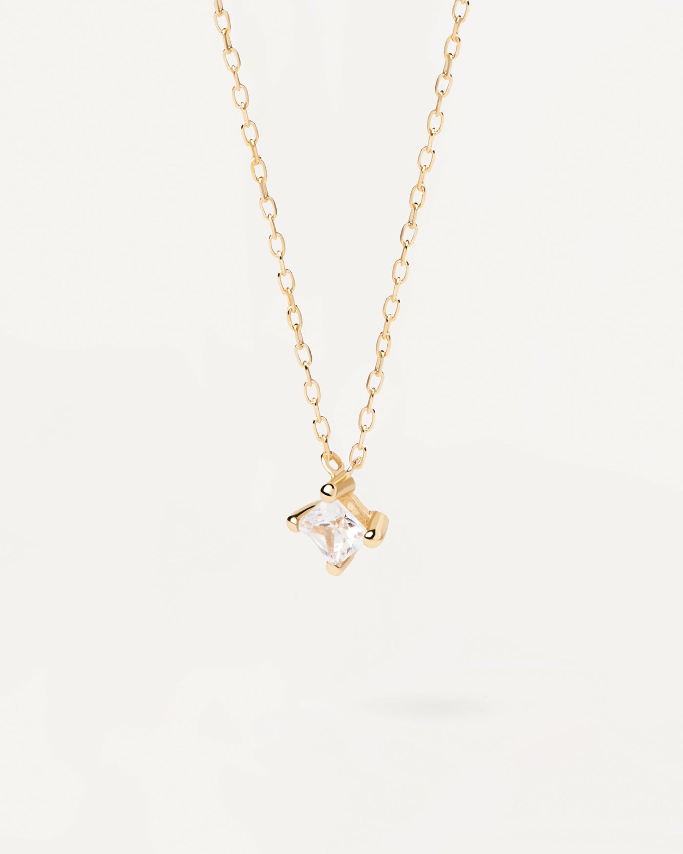 2023 Selection | Square Diamond And Gold Solitaire Necklace. 18K yellow gold necklace with squared princess diamond of 0.33 carat. Get the latest arrival from PDPAOLA. Place your order safely and get this Best Seller. Free Shipping.