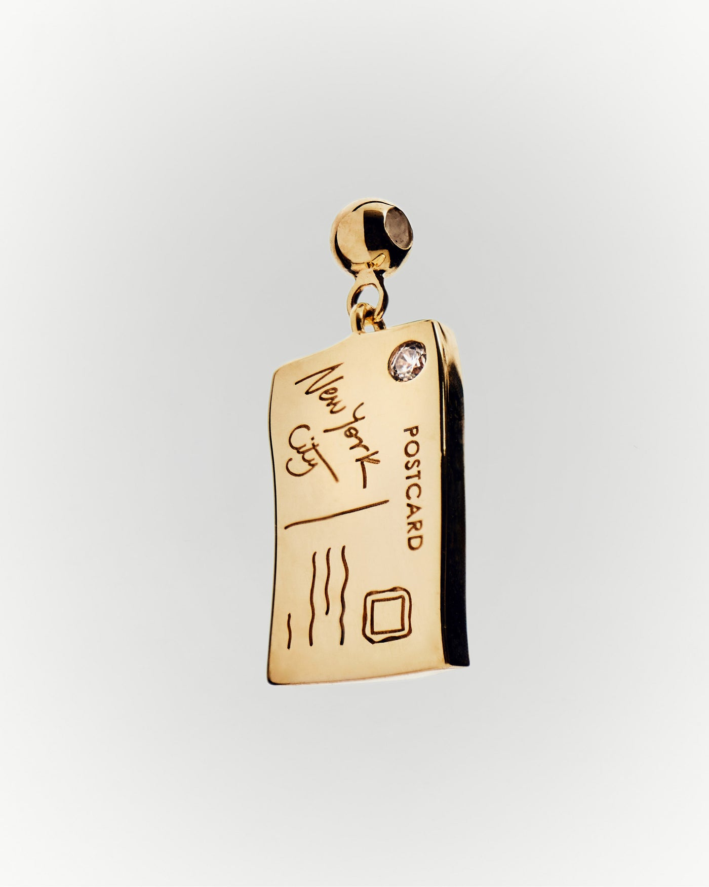 NY Postcard charm 
  
    Sterling Silver / 18K Gold plating
  
