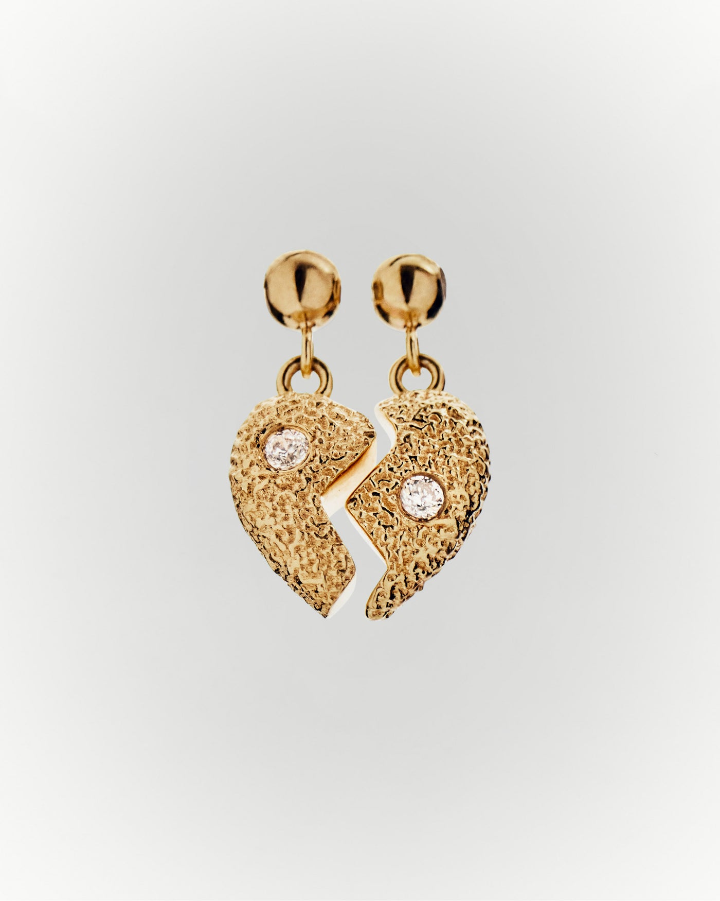 Split heart charm 
  
    Sterling Silver / 18K Gold plating
  
