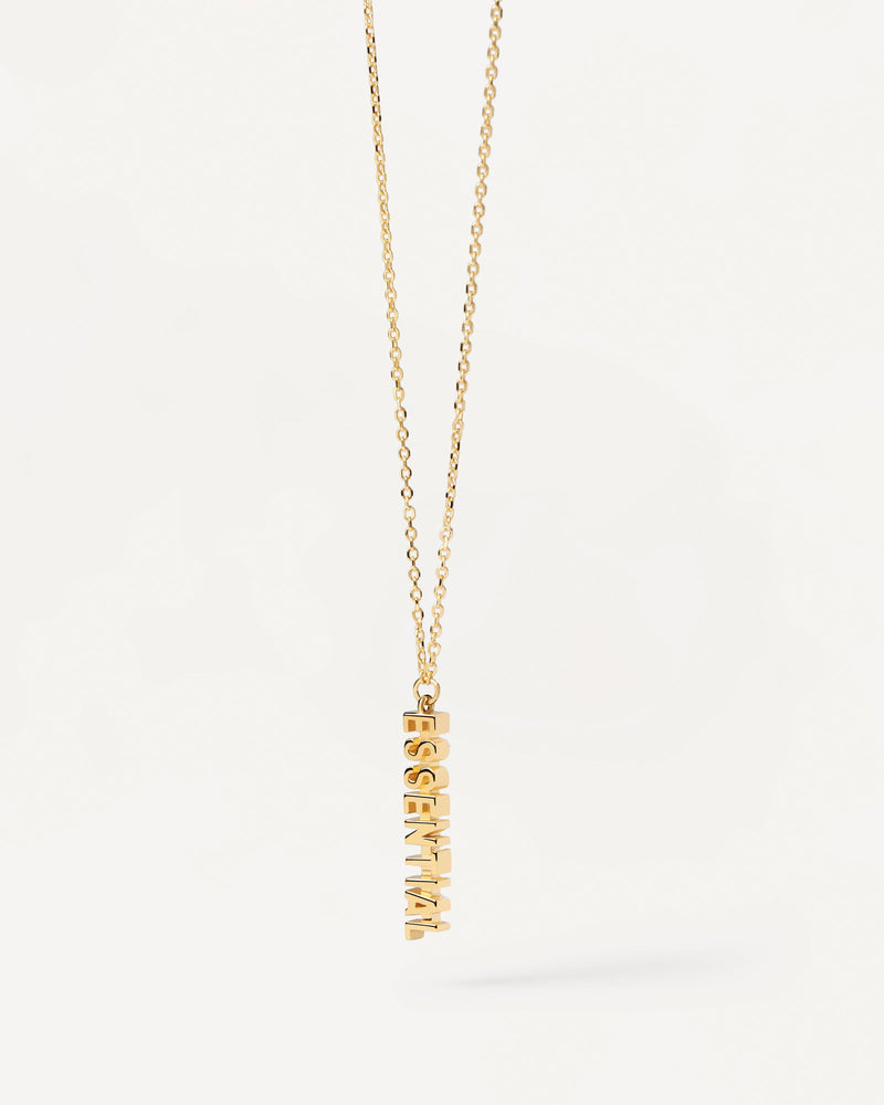 Gold-plated silver necklace with a word pendant: Essential