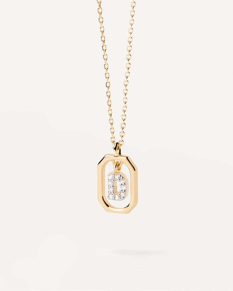 Ciondolo ottagonale piccolo in argento placcato oro con iniziale D in zirconii
