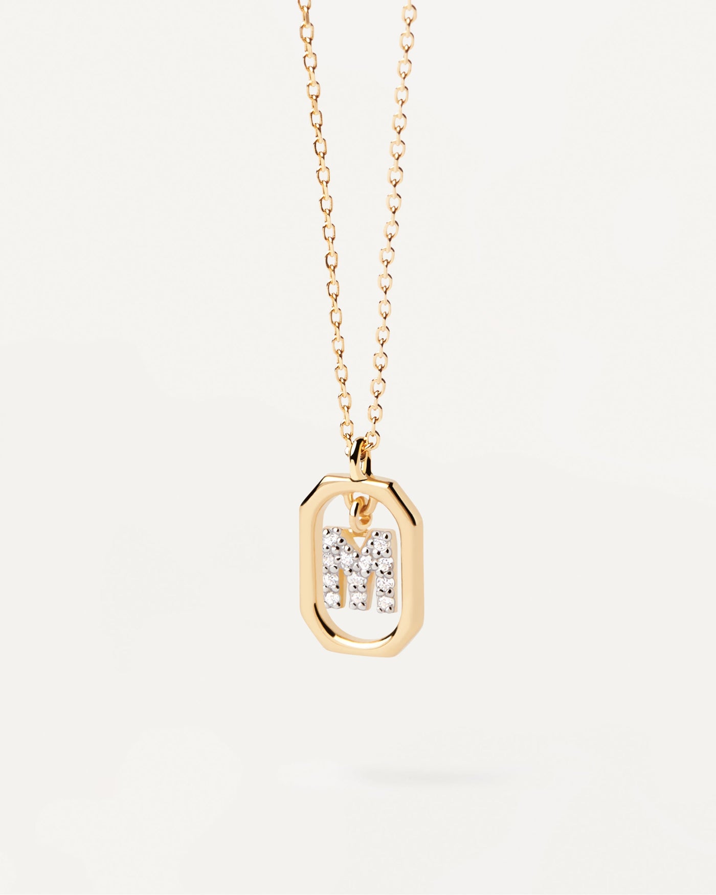 2023 Selection | Mini Letter M Necklace. Small initial M necklace in zirconia inside gold-plated silver octagonal pendant. Get the latest arrival from PDPAOLA. Place your order safely and get this Best Seller. Free Shipping.
