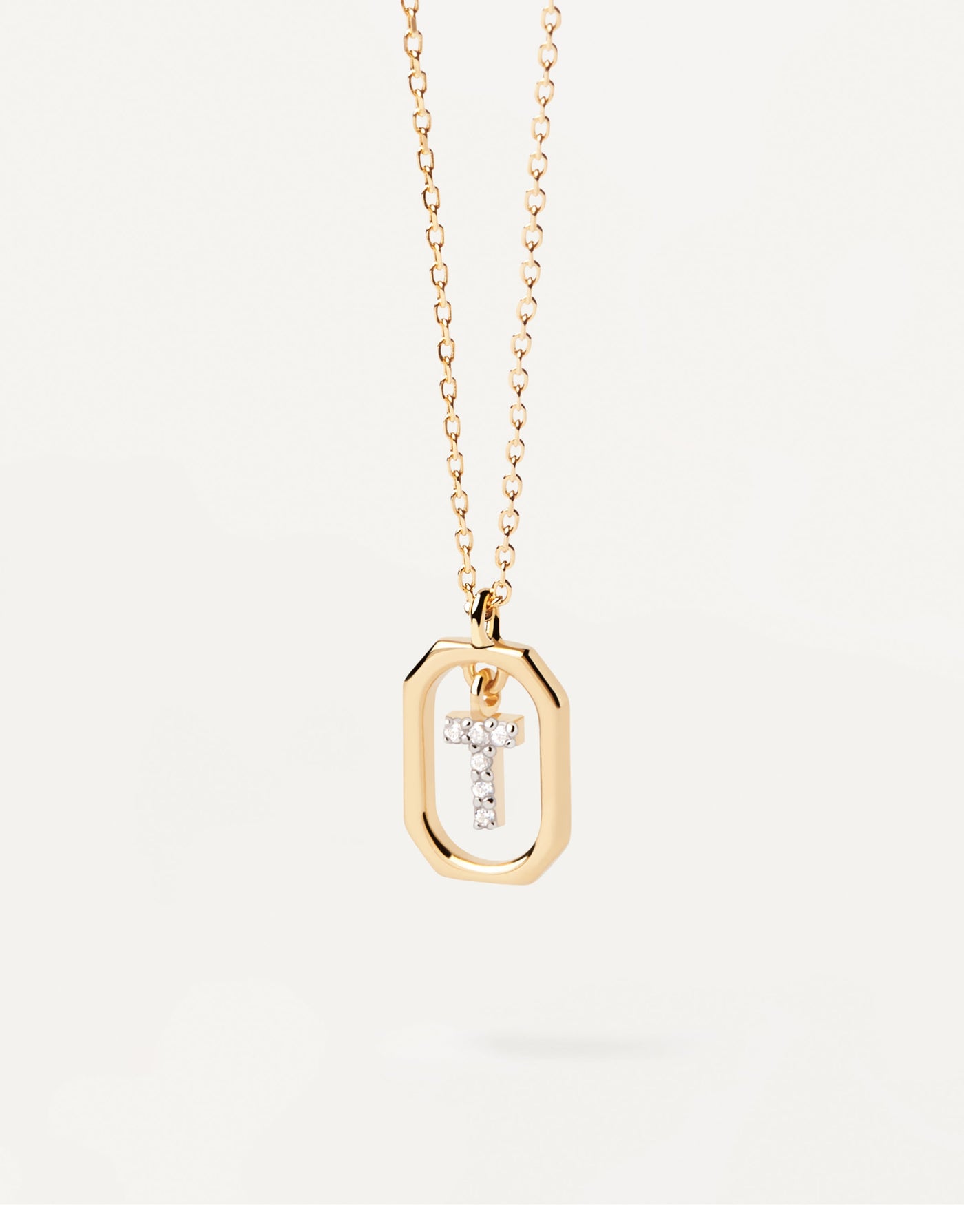 2023 Selection | Mini Letter T Necklace. Small initial T necklace in zirconia inside gold-plated silver octagonal pendant. Get the latest arrival from PDPAOLA. Place your order safely and get this Best Seller. Free Shipping.