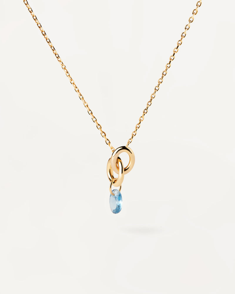 Collana placcata oro con due anelli collegati tra loro e ciondolo con zirconi blu a goccia
