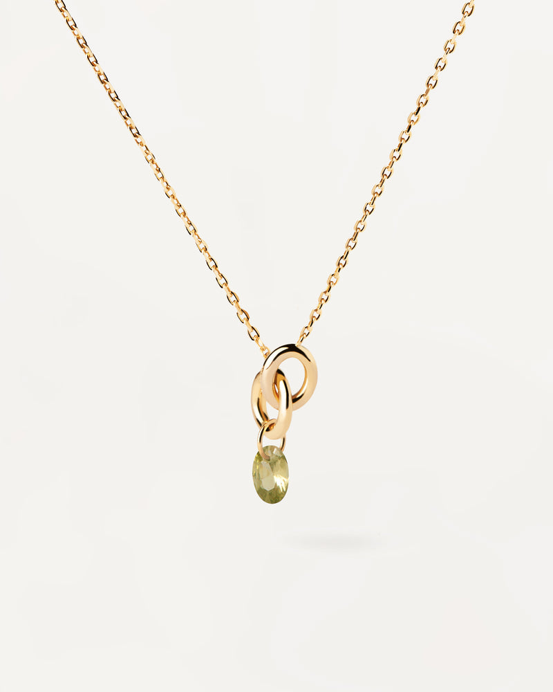 Collana placcata oro con due anelli collegati tra loro e ciondolo con zirconi verde a goccia