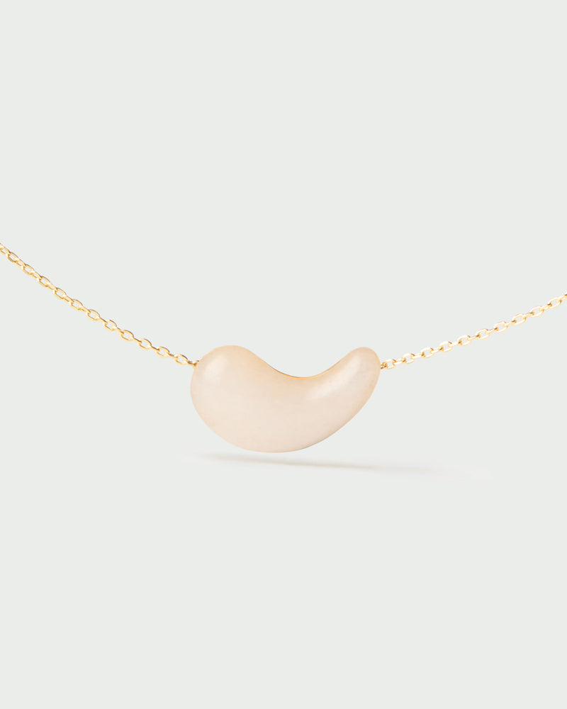 Gold-plated chain necklace with a white gemstone fluid drop