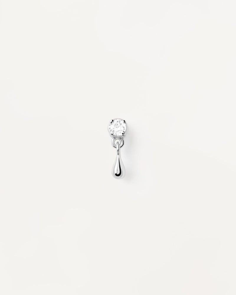Sterling silver ear piercing with white zirconia and small drop pendant