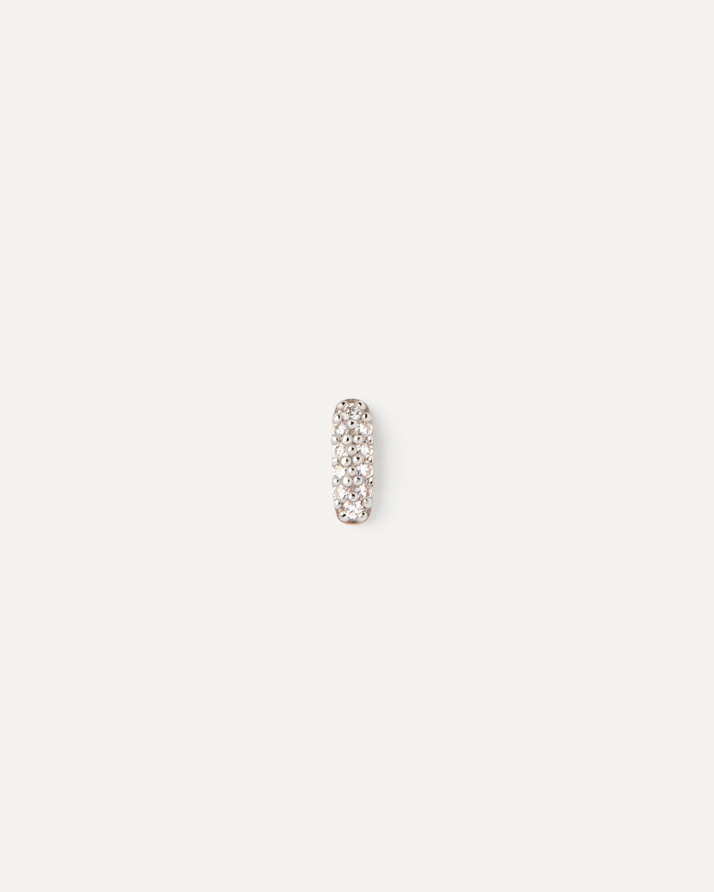 Diamonds and gold Pop single earring. Minimalist single earring in solid yellow gold set with an oval shape pavé lab-grown diamond. Get the latest arrival from PDPAOLA. Place your order safely and get this Best Seller.