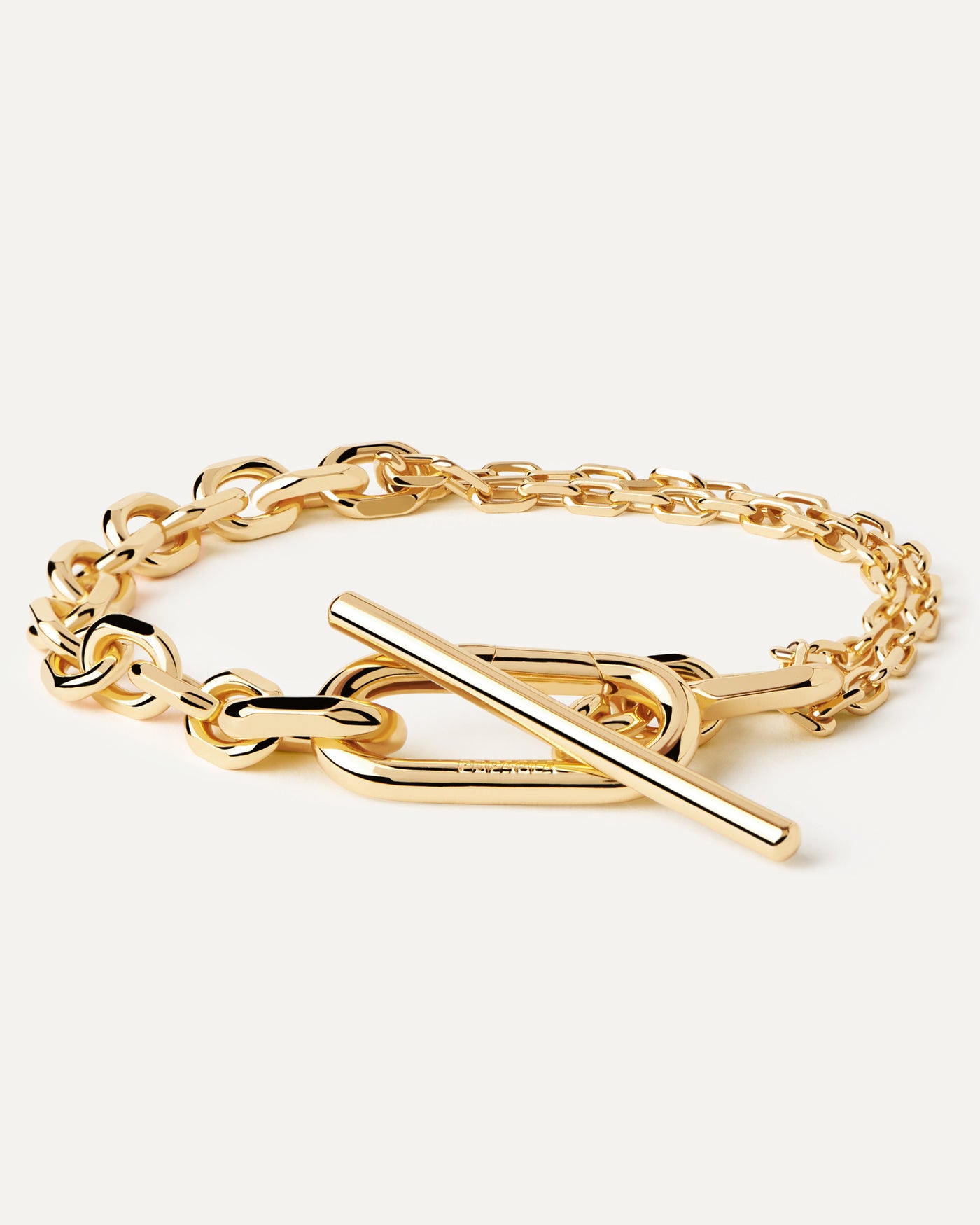 2023 Selection | Vesta Chain Bracelet. Gold-plated double chain T-bar bracelet with bold clasp and asymmetrical links. Get the latest arrival from PDPAOLA. Place your order safely and get this Best Seller. Free Shipping.
