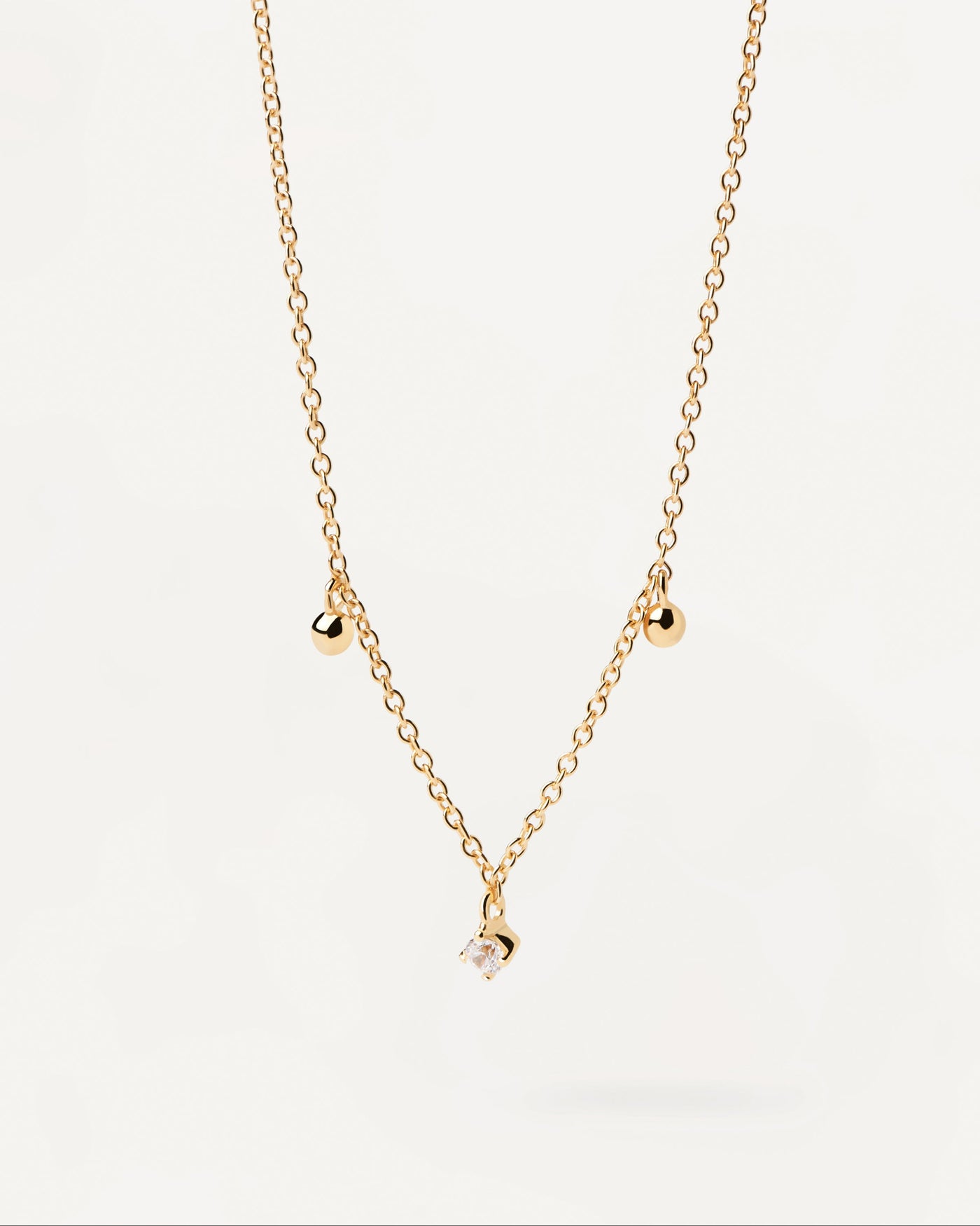 2023 Selection | Love Triangle Necklace. Gold-plated chain necklace with dainty balls and white zirconia. Get the latest arrival from PDPAOLA. Place your order safely and get this Best Seller. Free Shipping.