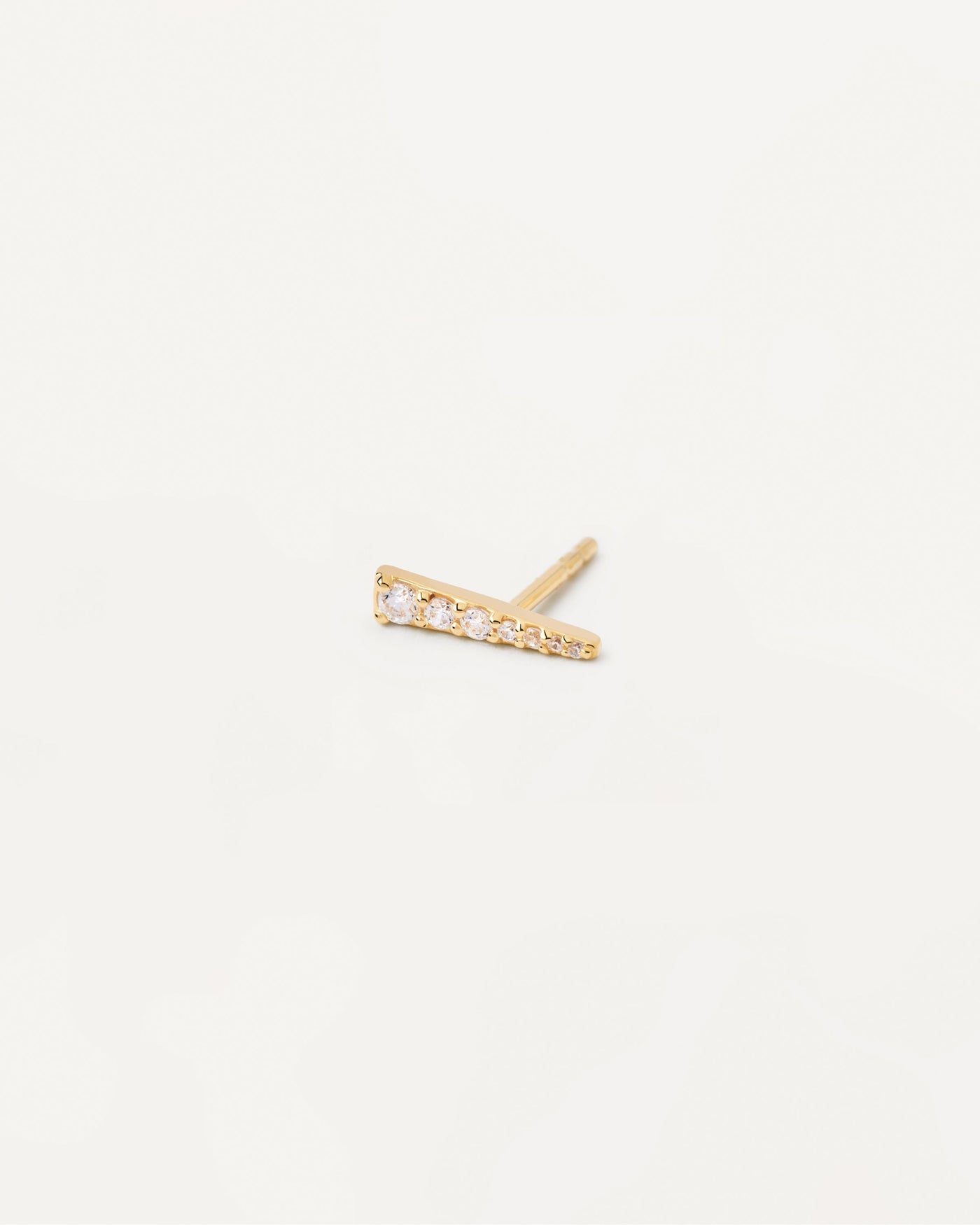 2023 Selection | Tea Single Earring. Gold-plated ear piercing in tip shape with white crystals. Get the latest arrival from PDPAOLA. Place your order safely and get this Best Seller. Free Shipping.