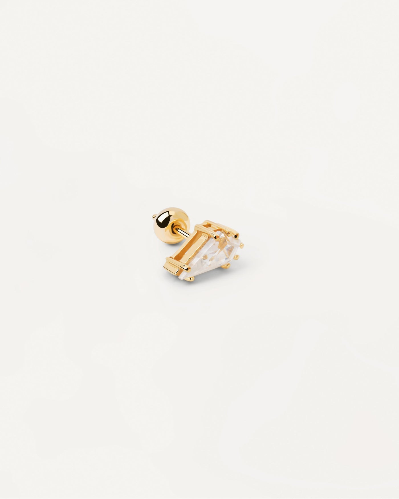 Pendiente Individual Noa. Piercing de oreja bañado en oro con circonita blanca en forma de gota. Consigue las últimas novedades de PDPAOLA. Haz tu pedido de forma segura y obtén este Best Seller.