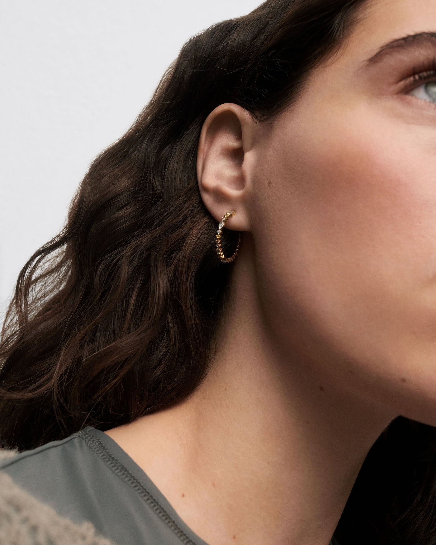Gold plated open hoops set with multicolor zirconia that graduate i. Lotus hoops PDPAOLA