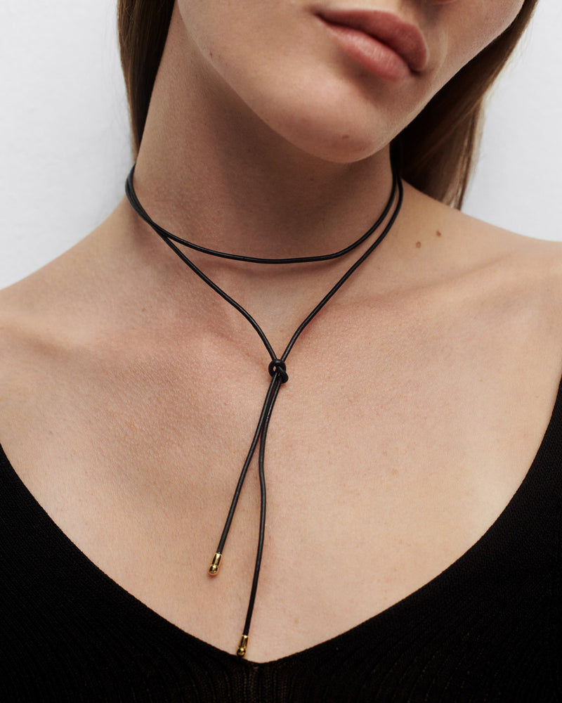 Dana leather bow necklace - 
  
    MDF and Faux Leather / 18K Gold plating
  

