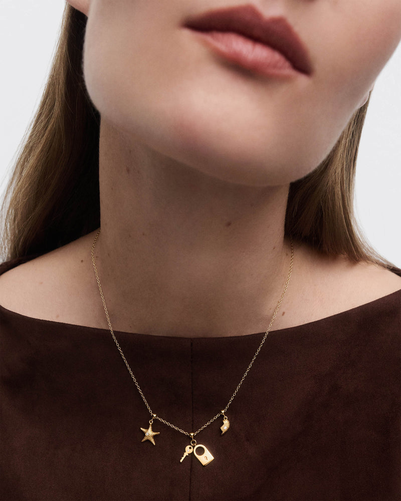 Charm Lucchetto e chiave - 
  
    Argento sterling / Placcatura in Oro 18K
  
