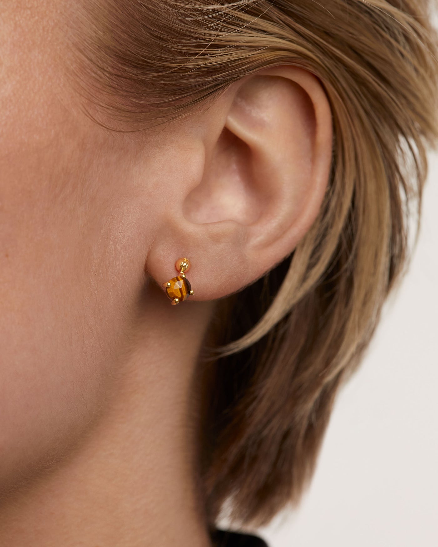 Tiger eye  ear piercings