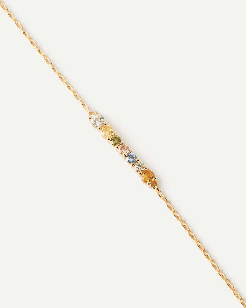 Bracciale placcata oro con una serie ondulata di zirconi multicolore