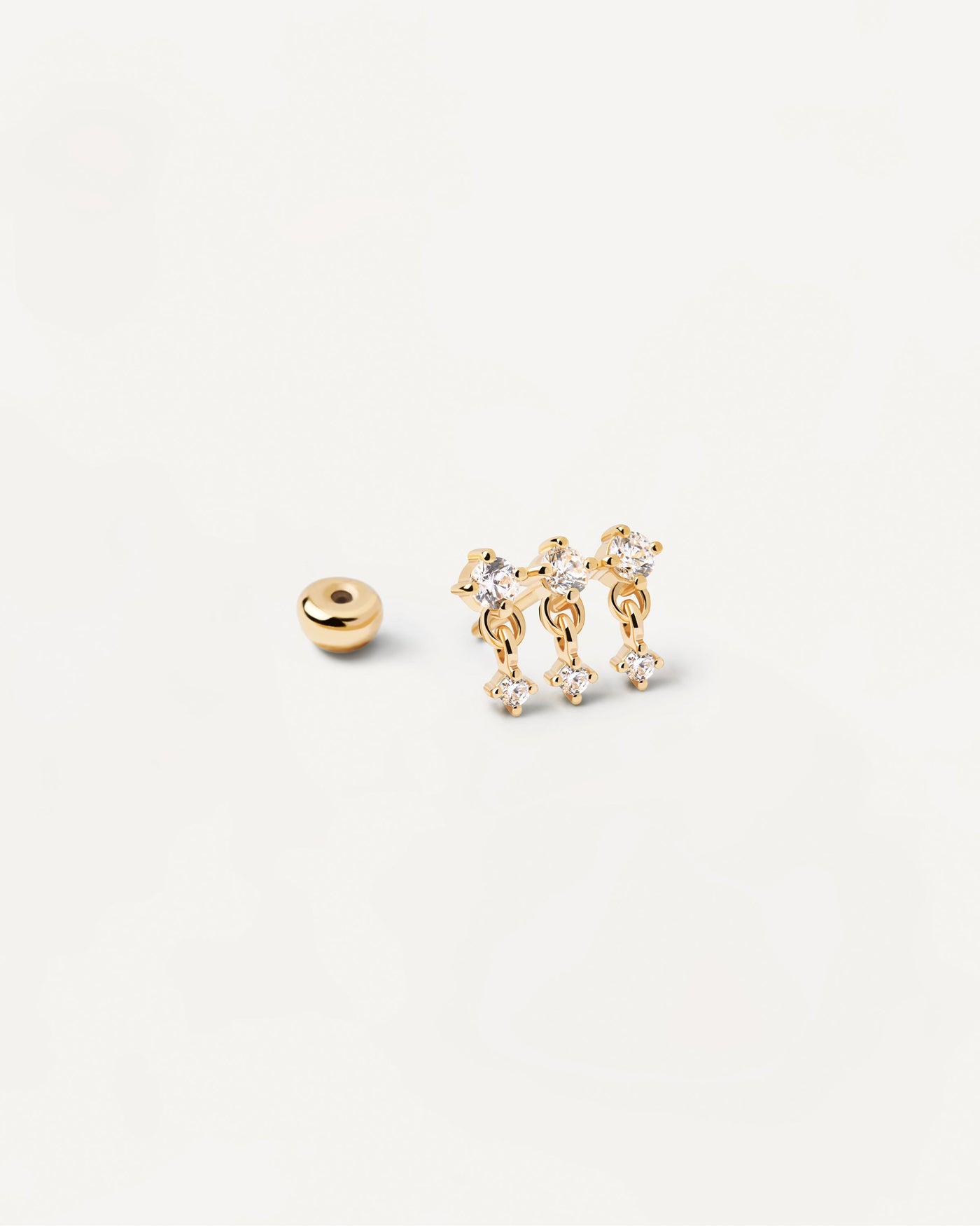 Sol Einzelner Ohrring. Wellenförmiger vergoldeter Piercing-Ohrring mit drei weißen Zirkonias. Erhalten Sie die neuesten Produkte von PDPAOLA. Geben Sie Ihre Bestellung sicher auf und erhalten Sie diesen Bestseller.