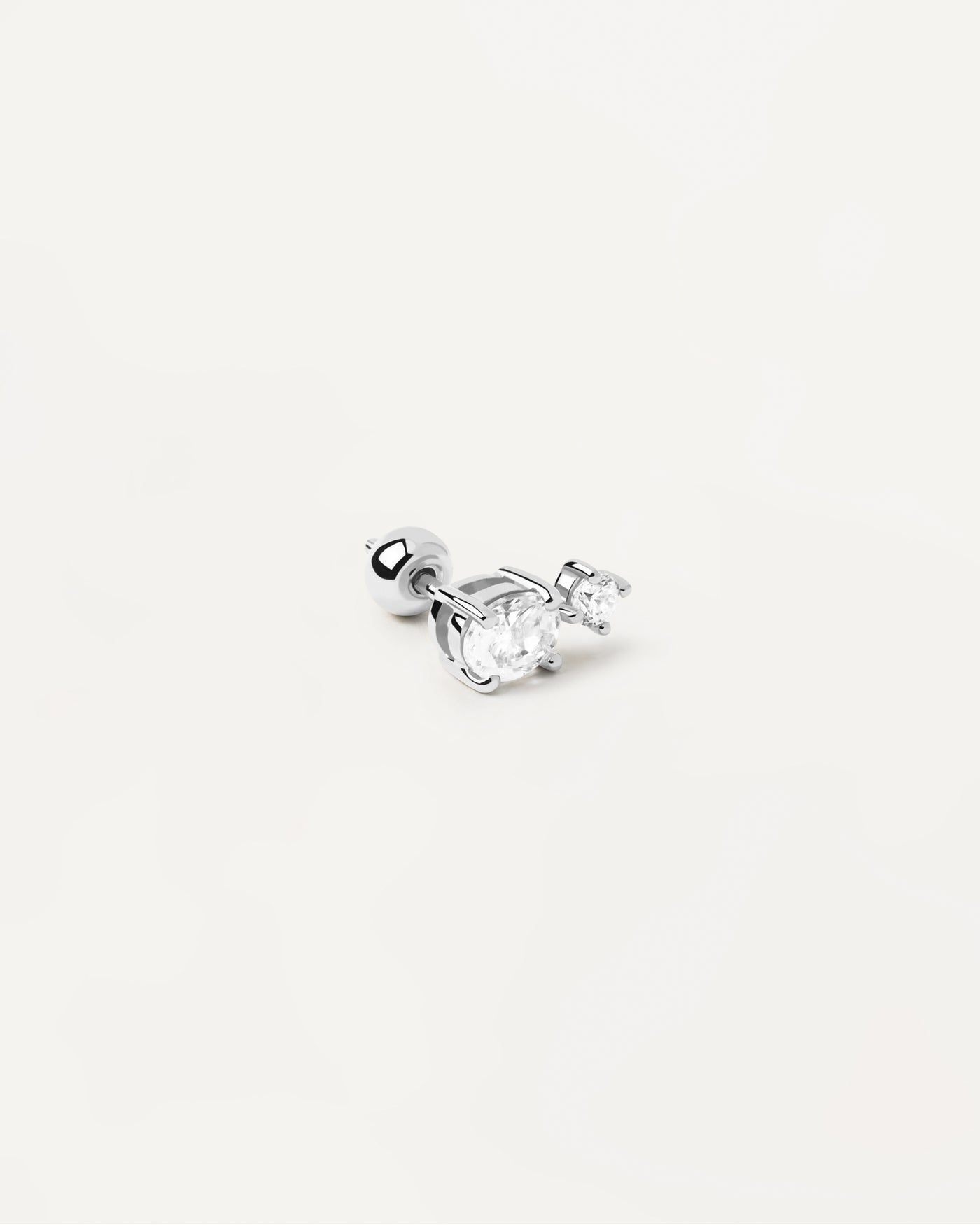 2023 Selection | Nikita Single Silver Earring. 2 white zirconia ear piercing in sterling silver. Get the latest arrival from PDPAOLA. Place your order safely and get this Best Seller. Free Shipping.