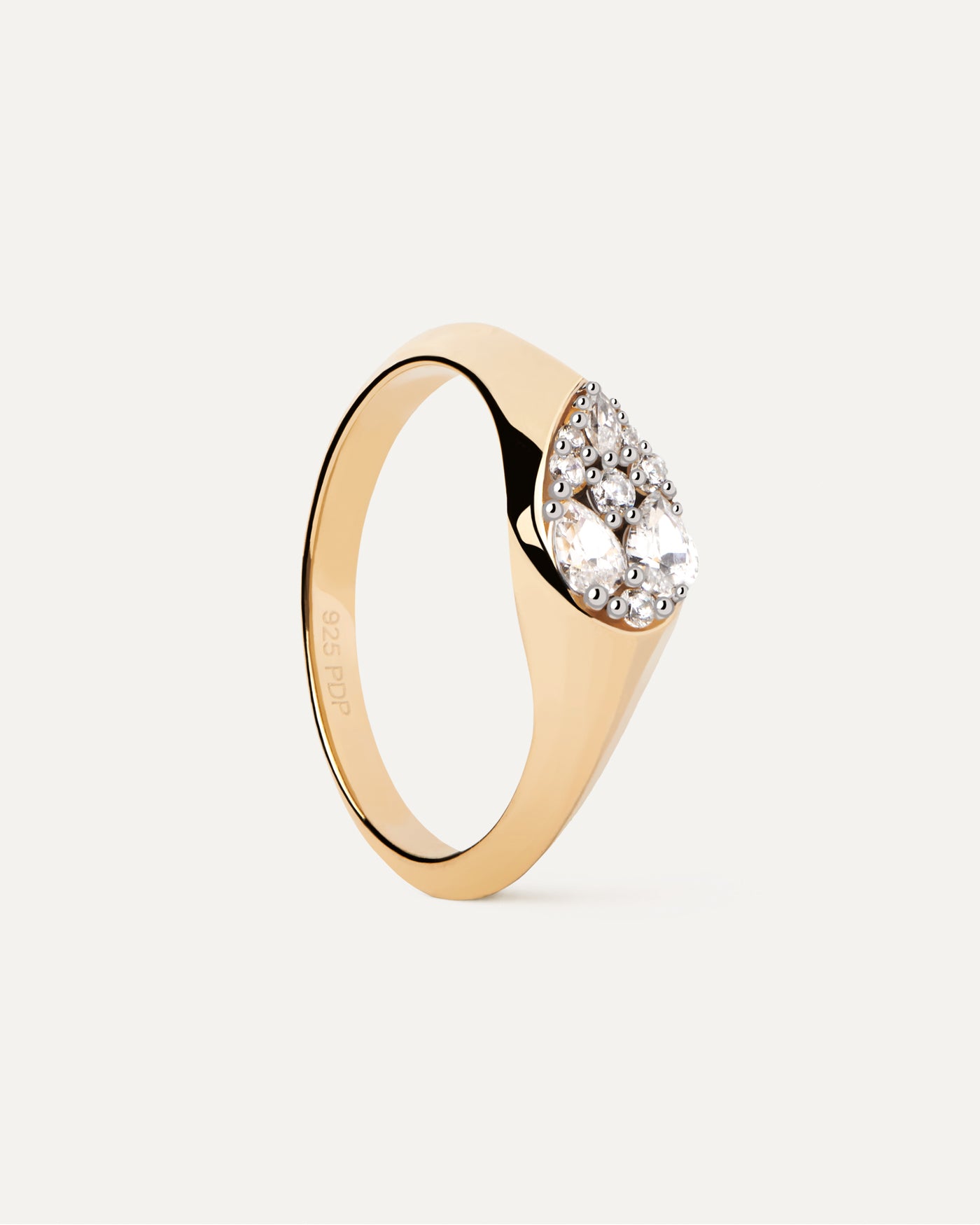 2023 Selection | Vanilla Stamp Ring. Gold-plated signet ring set with pear shape white zirconia multi-stone cluster. Get the latest arrival from PDPAOLA. Place your order safely and get this Best Seller. Free Shipping.